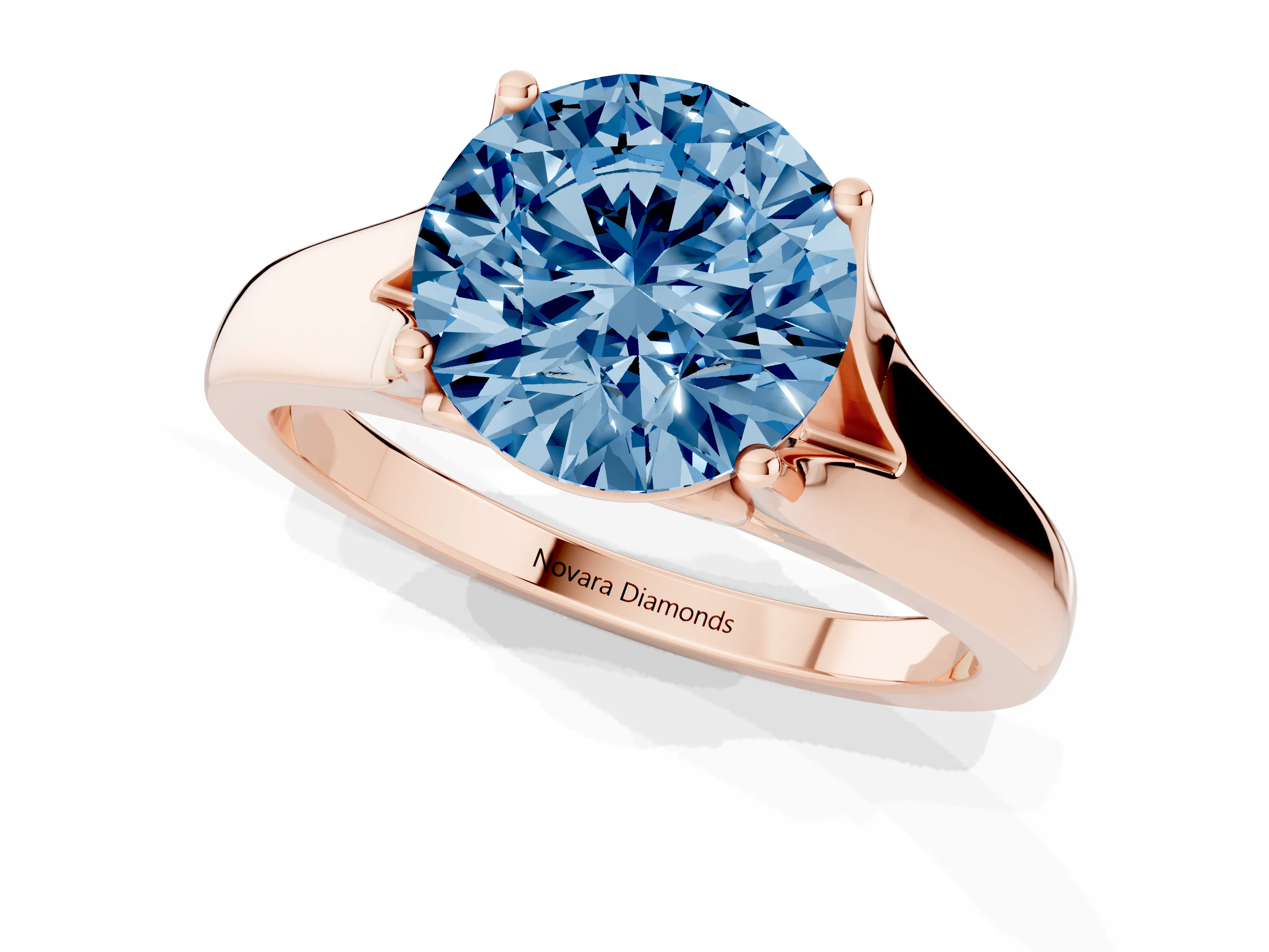 Fancy Blue Round Cut Diamond Solitaire Ring Set in Rose gold with Arched Cathedral Band and Prong Setting