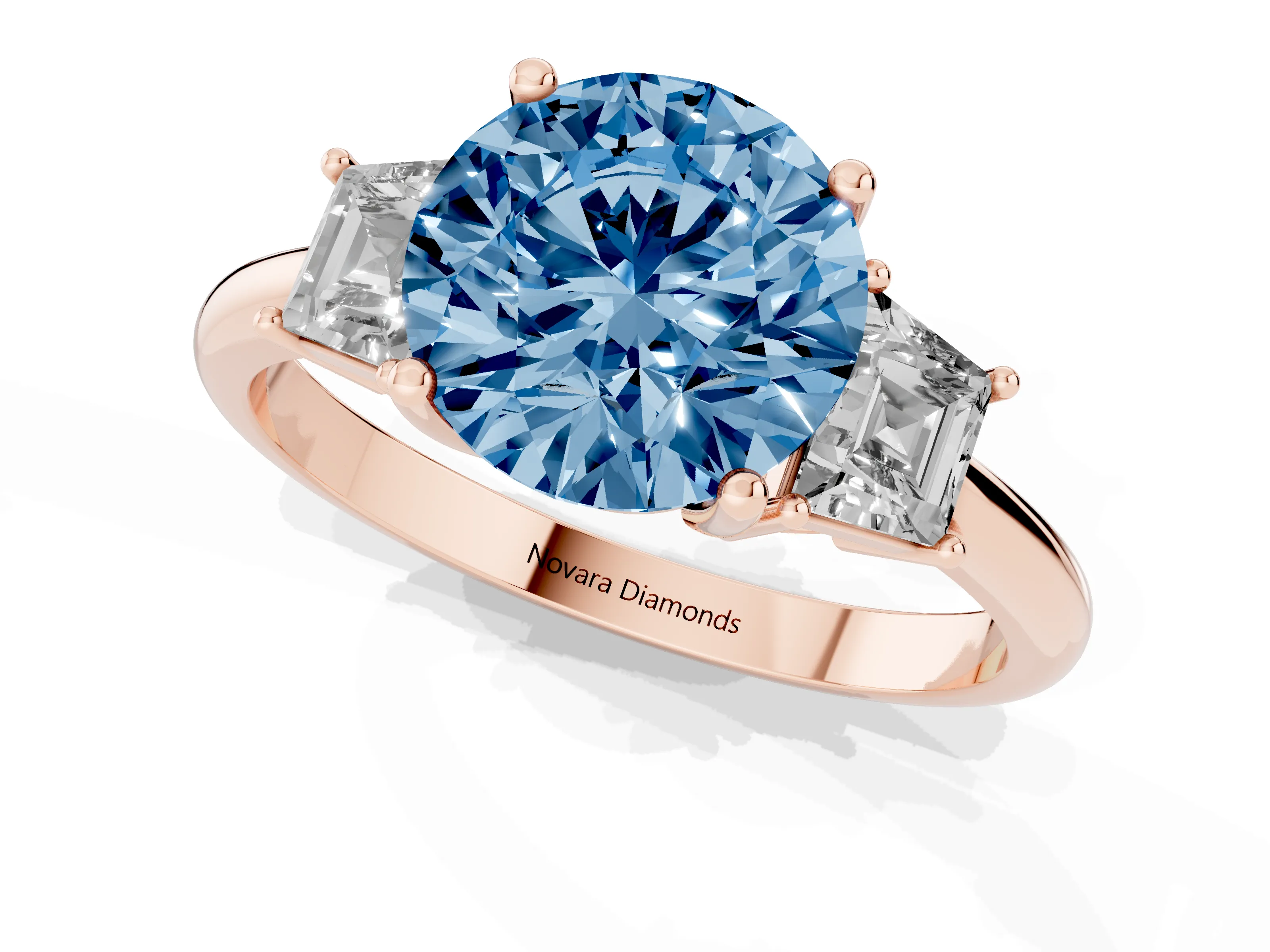 Fancy Blue Round Cut Diamond Three-Stone Ring Set in Rose gold with Trapezoid Side Stones and Prong Setting