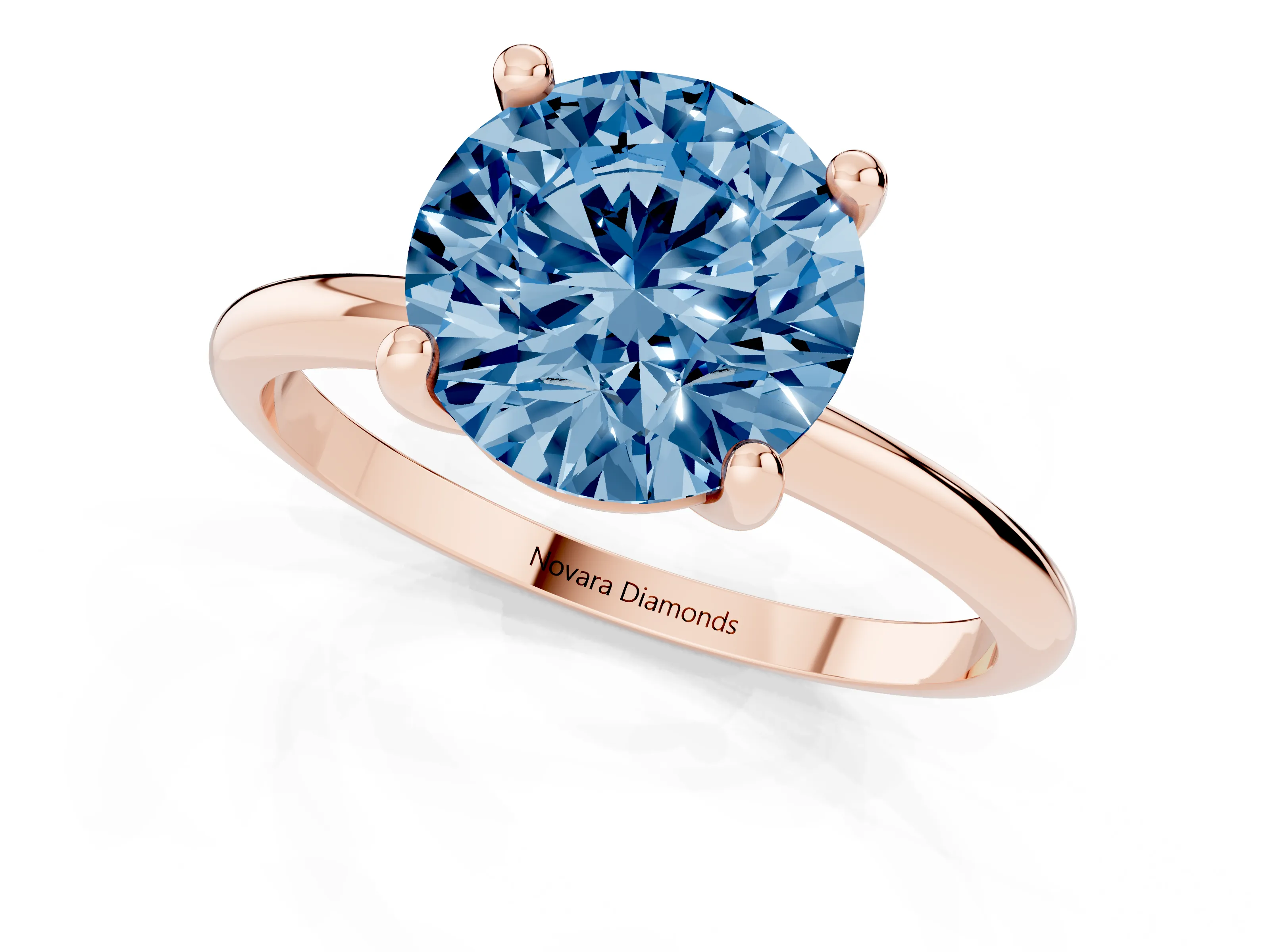 Fancy Blue Round Cut Diamond Solitaire Ring Set in Rose gold with Secure Prong Setting on a Classic Band