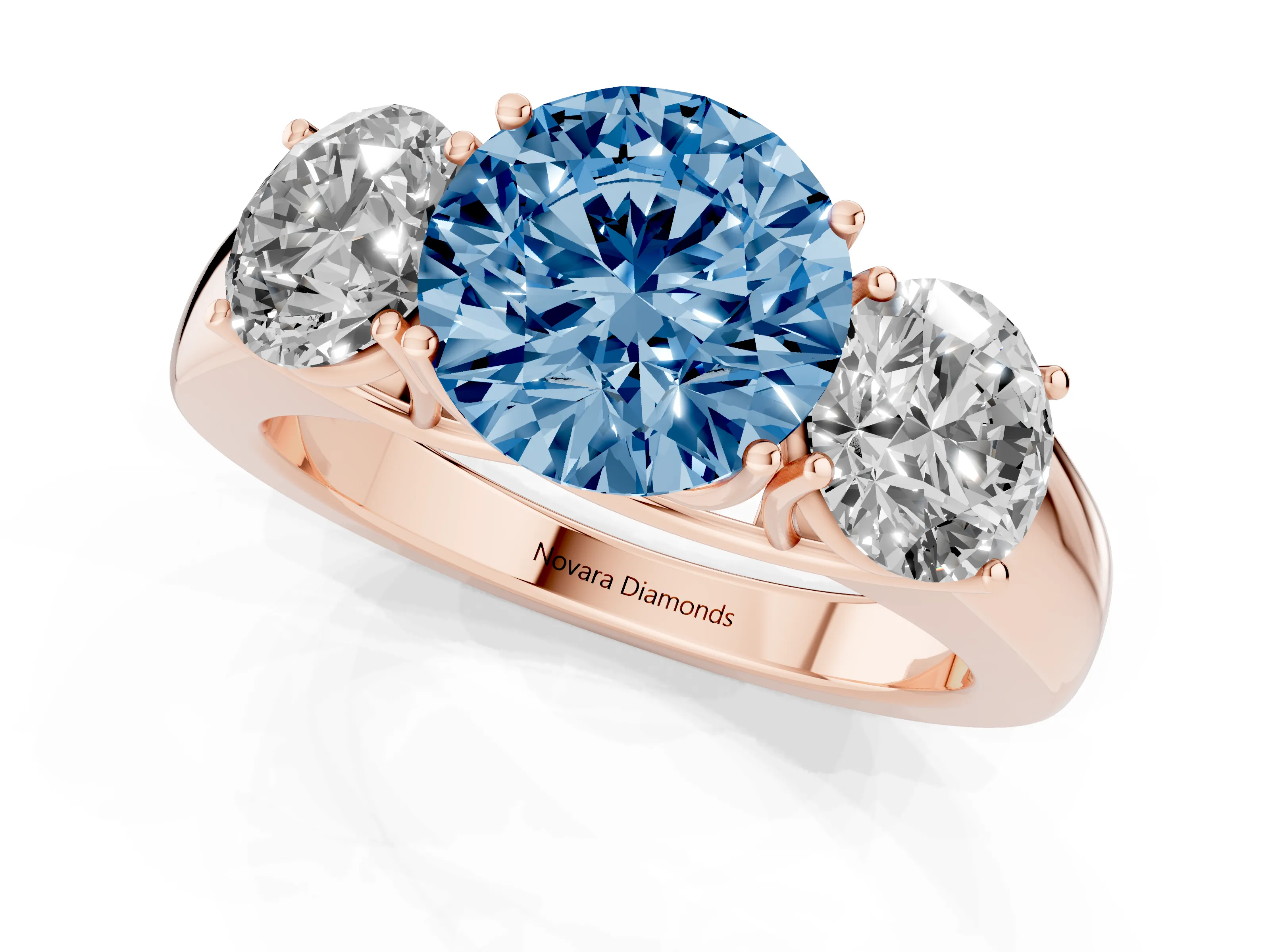 Fancy Blue Three-Stone Round Cut Diamond Ring Set in Rose gold with Matching Prong Settings and Plain Band