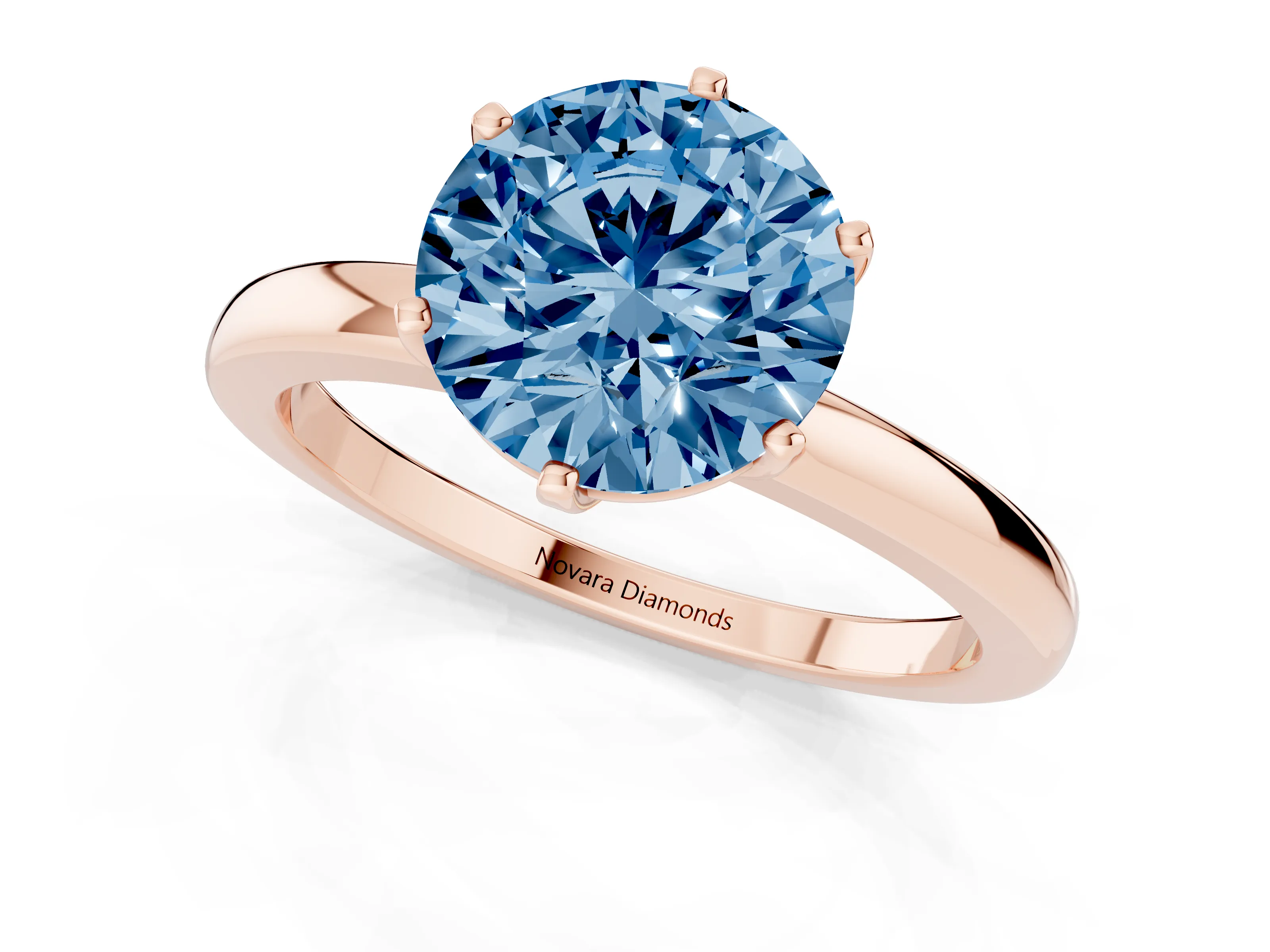 Fancy Blue Round Cut Diamond Solitaire Ring Set in Rose gold with Raised Prong Setting on a Classic Band