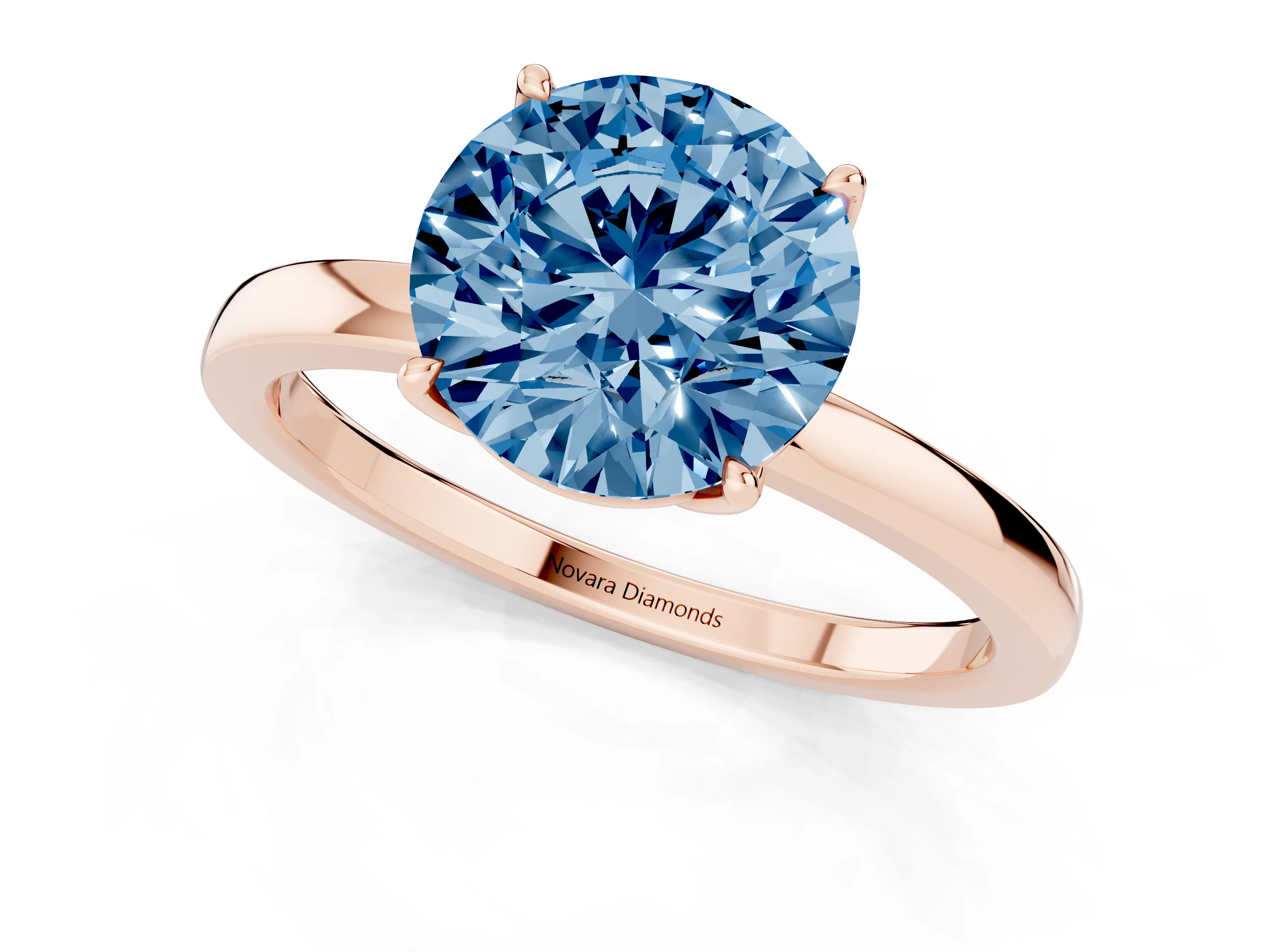 Fancy Blue Round Cut Diamond Solitaire Ring Set in Rose gold with Prong Setting and Thin Polished Band