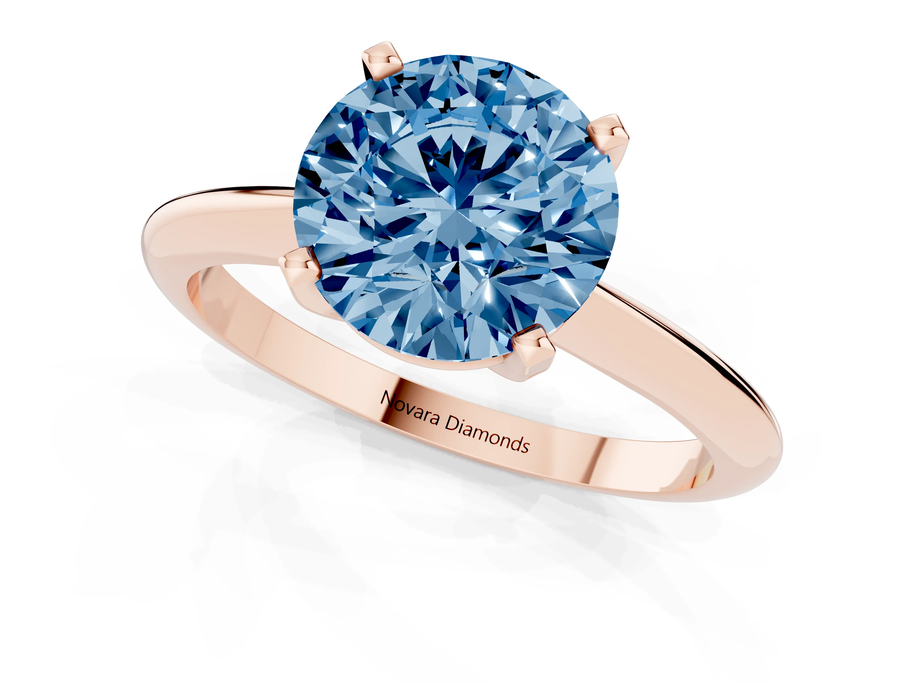 Fancy Blue Round Cut Diamond Solitaire Ring Set in Rose gold with Prong Setting on a Plain Round Band