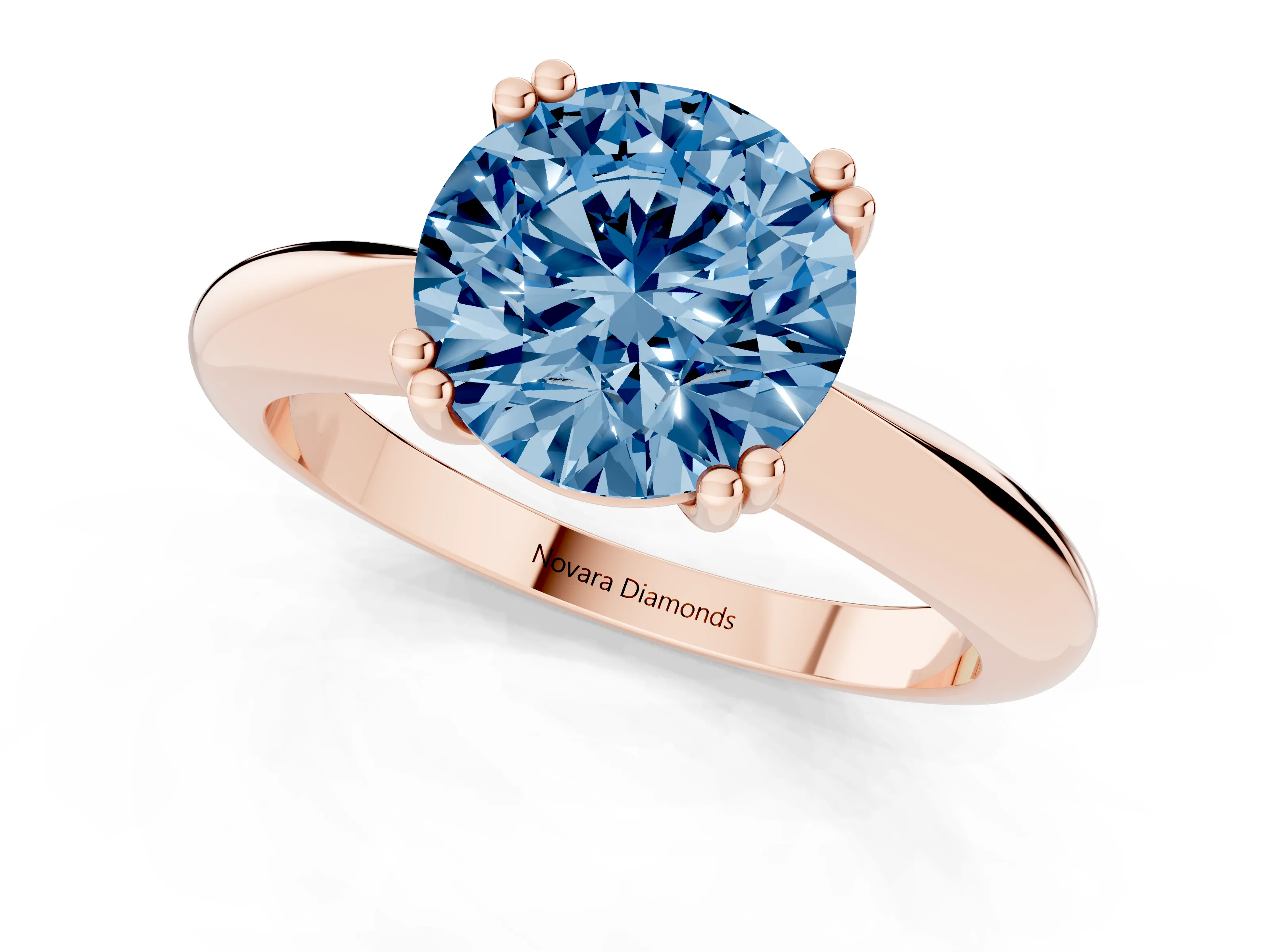 Fancy Blue Round Cut Diamond Solitaire Engagement Ring Set in Rose gold with Tapered Band and Prong Setting