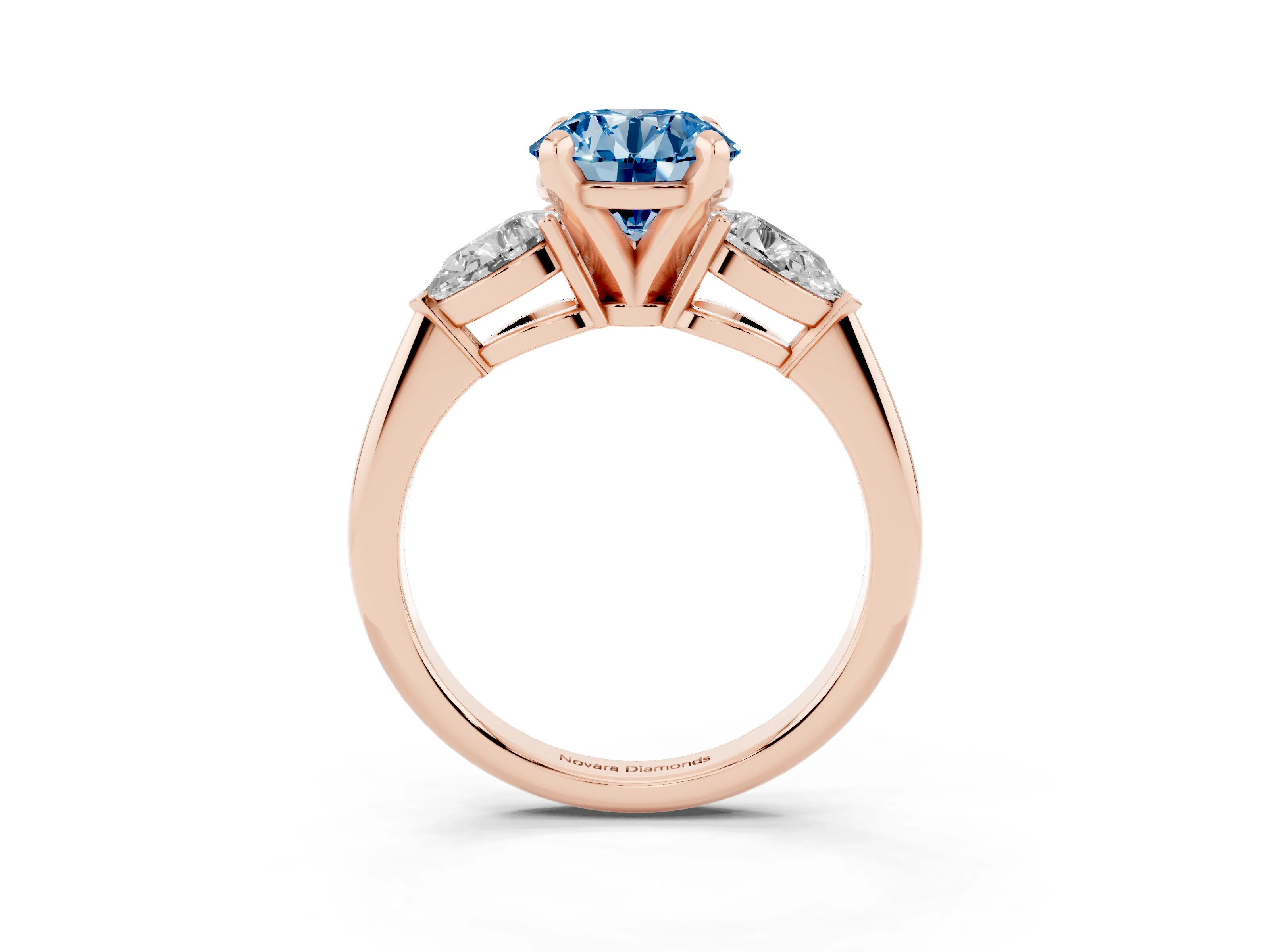 Fancy Blue Three-Stone Round Cut Diamond Ring Set in Rose gold with Pear Side Stones and Prong Setting