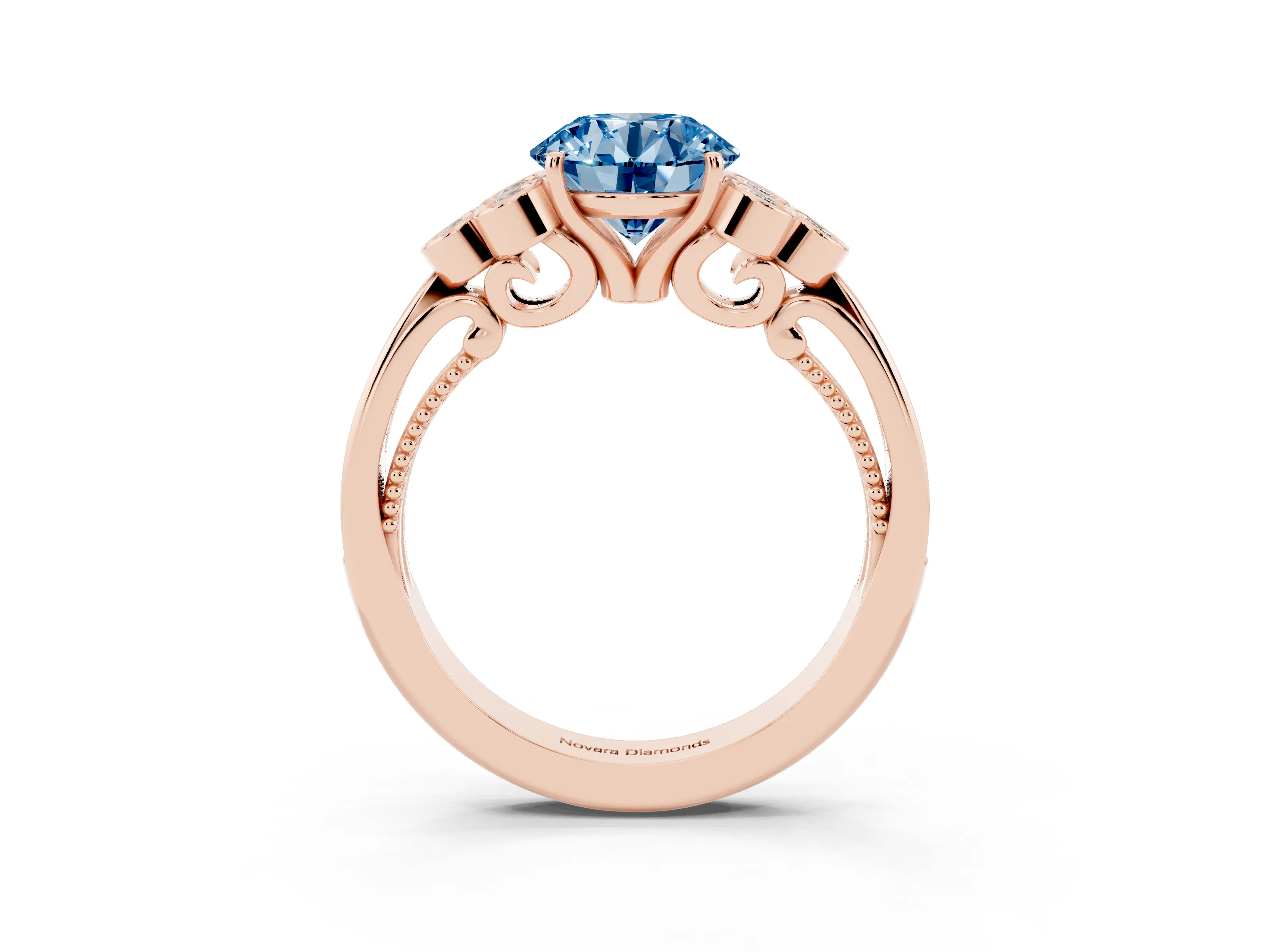Fancy Blue Round Cut Diamond Engagement Ring Set in Rose gold with Bezel Set Round Side Stones and Prong Setting