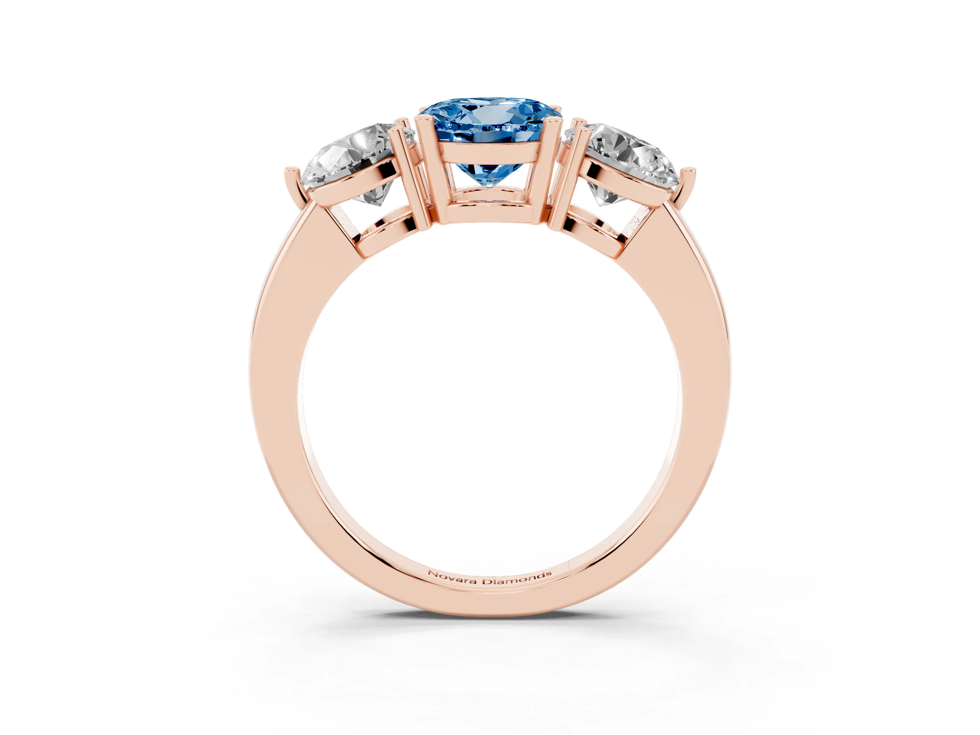 Fancy Blue Round Cut Diamond Three-Stone Ring Set in Rose gold with Prong Setting and Plain Band