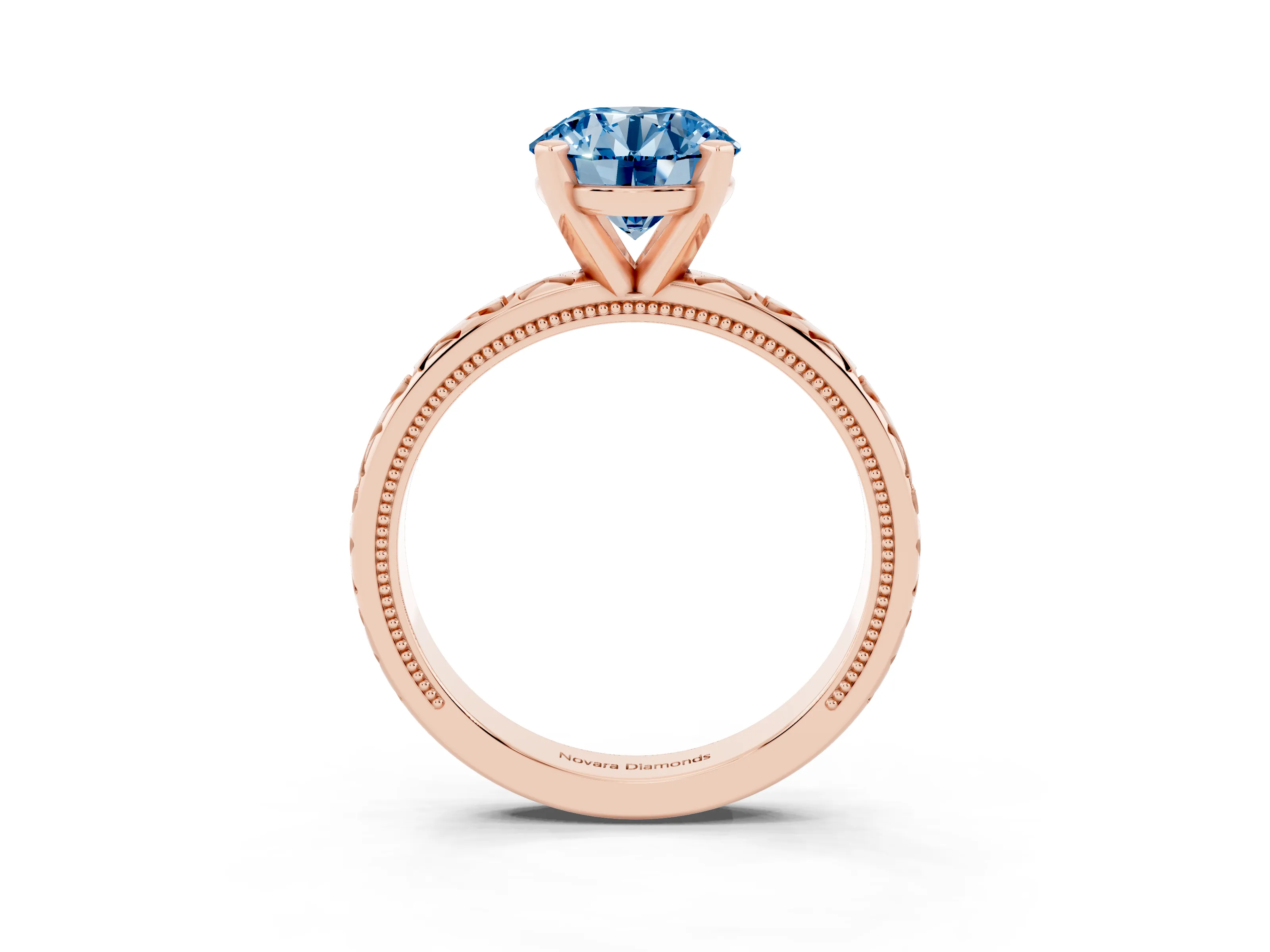 Fancy Blue Round Cut Diamond Solitaire Engagement Ring Set in Rose gold with XO Engraved Band and Prong Setting