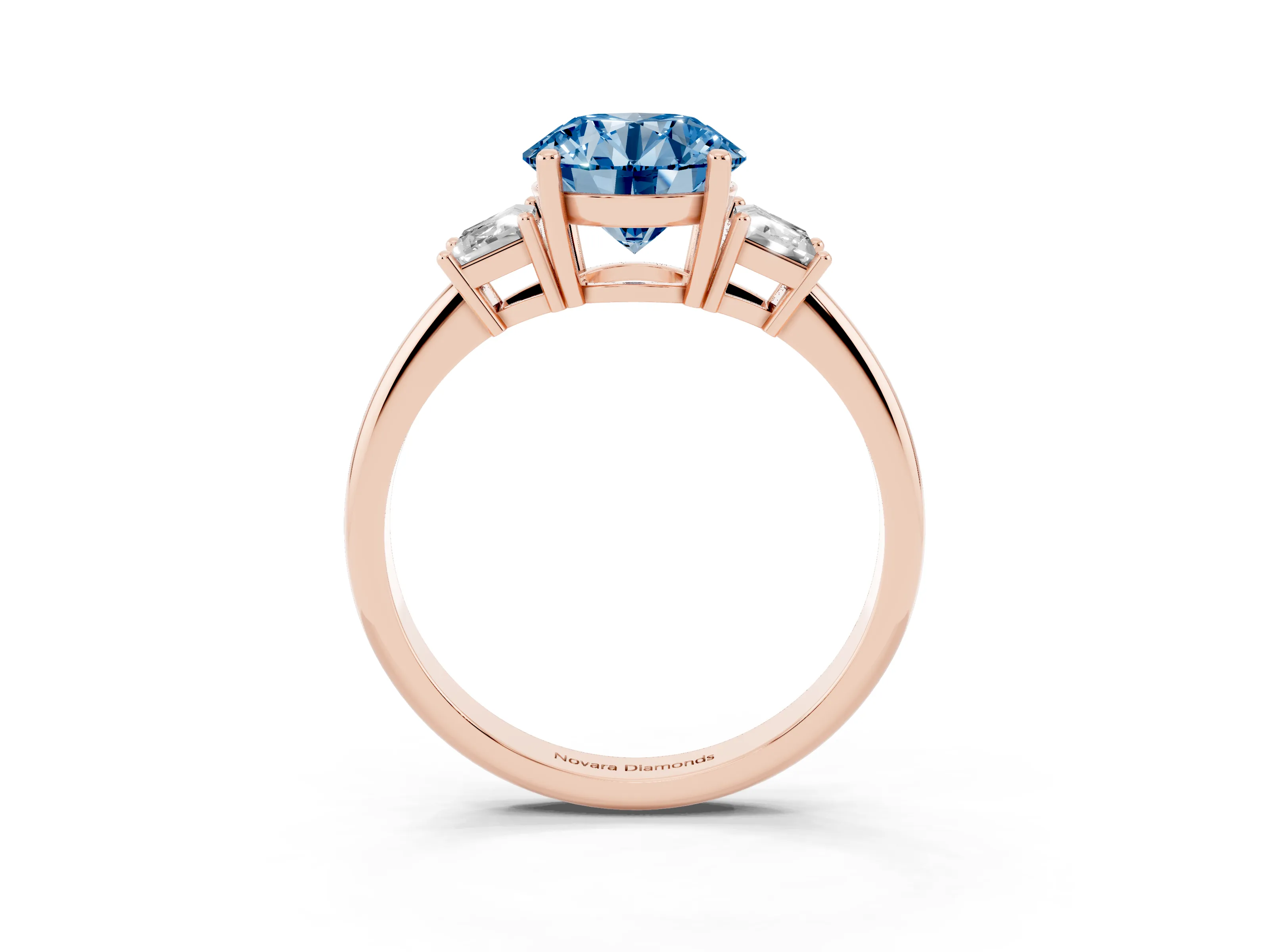 Fancy Blue Round Cut Diamond Three-Stone Ring Set in Rose gold with Trapezoid Side Stones and Prong Setting
