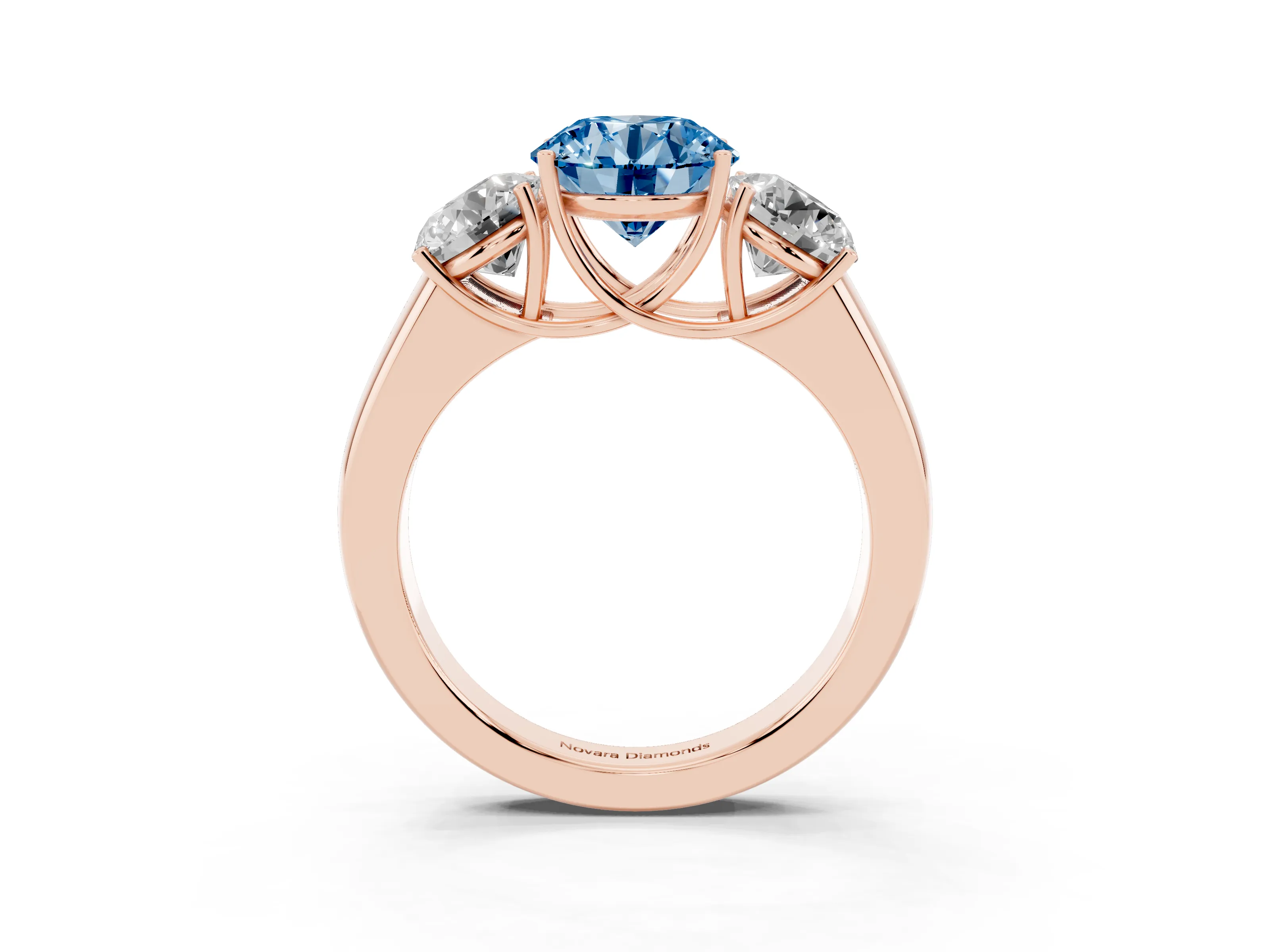 Fancy Blue Three-Stone Round Cut Diamond Ring Set in Rose gold with Matching Prong Settings and Plain Band