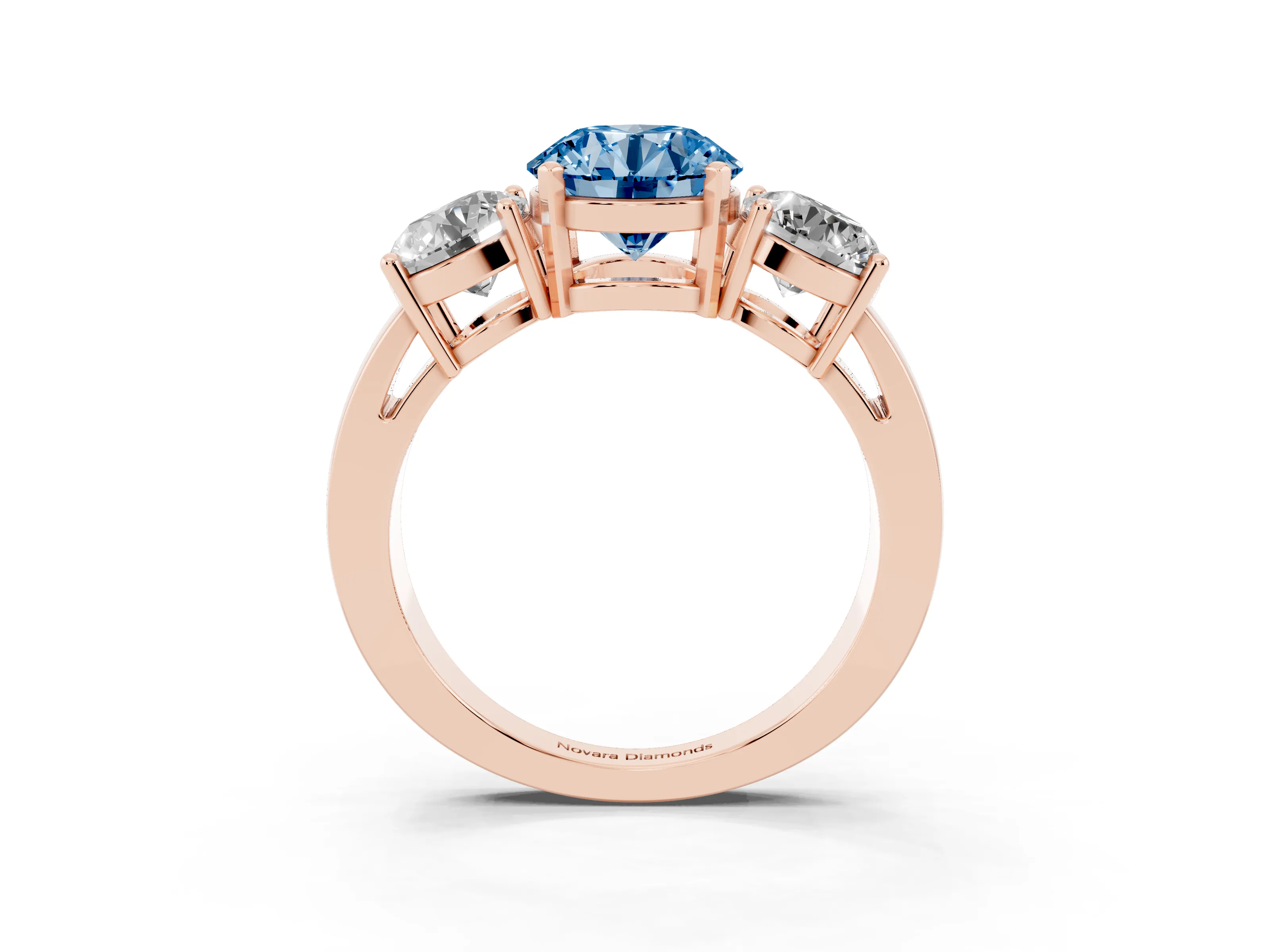 Fancy Blue Round Cut Diamond Three-Stone Ring Set in Rose gold with Round Side Stones and Classic Band
