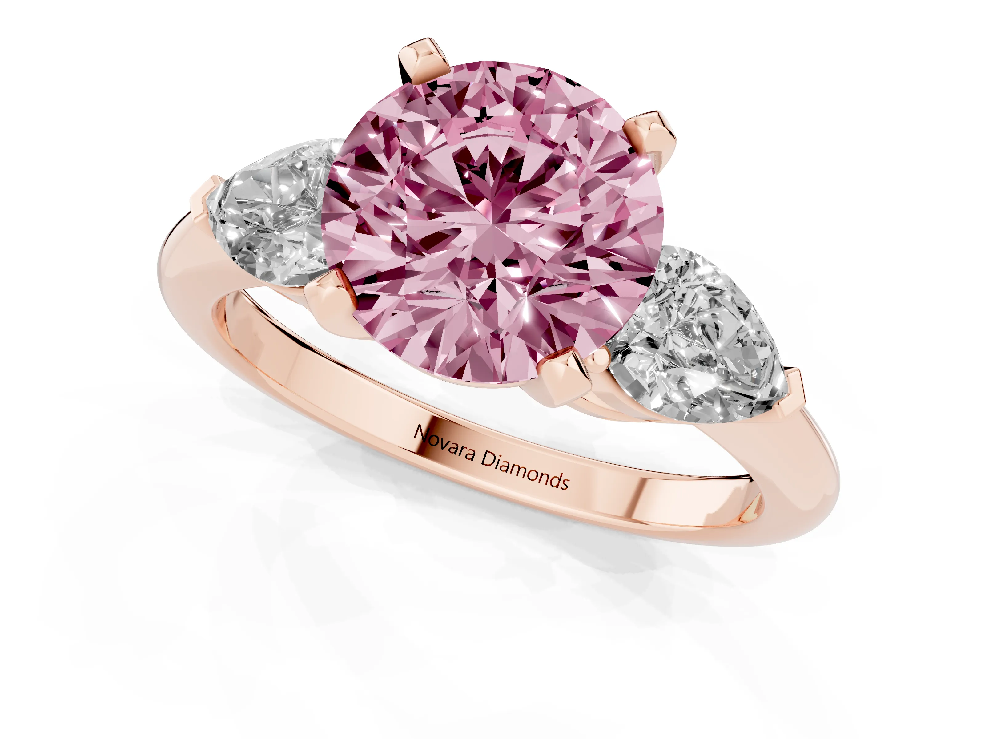 Fancy Pink Three-Stone Round Cut Diamond Ring Set in Rose gold with Pear Side Stones and Prong Setting