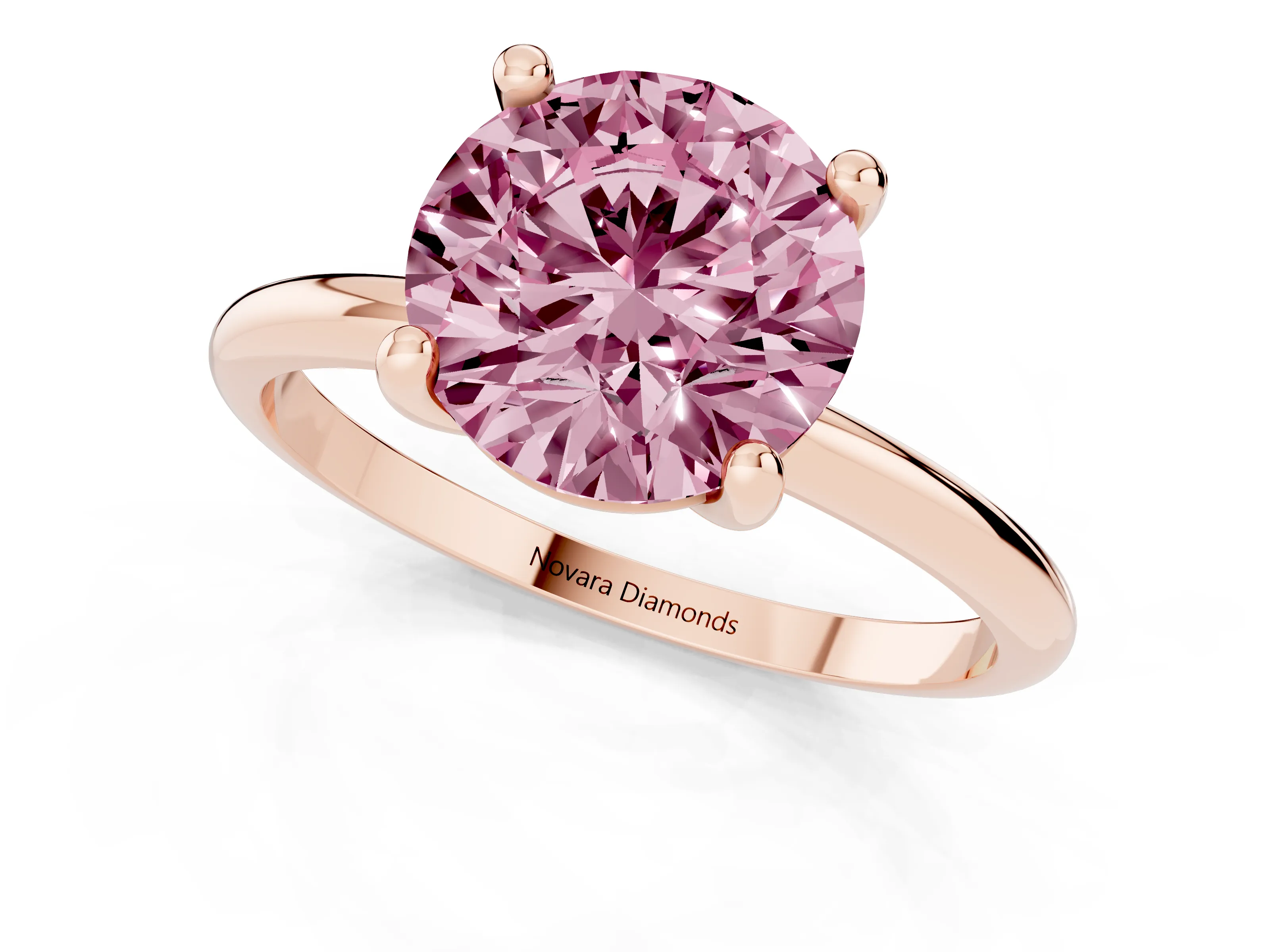 Fancy Pink Round Cut Diamond Solitaire Ring Set in Rose gold with Secure Prong Setting on a Classic Band
