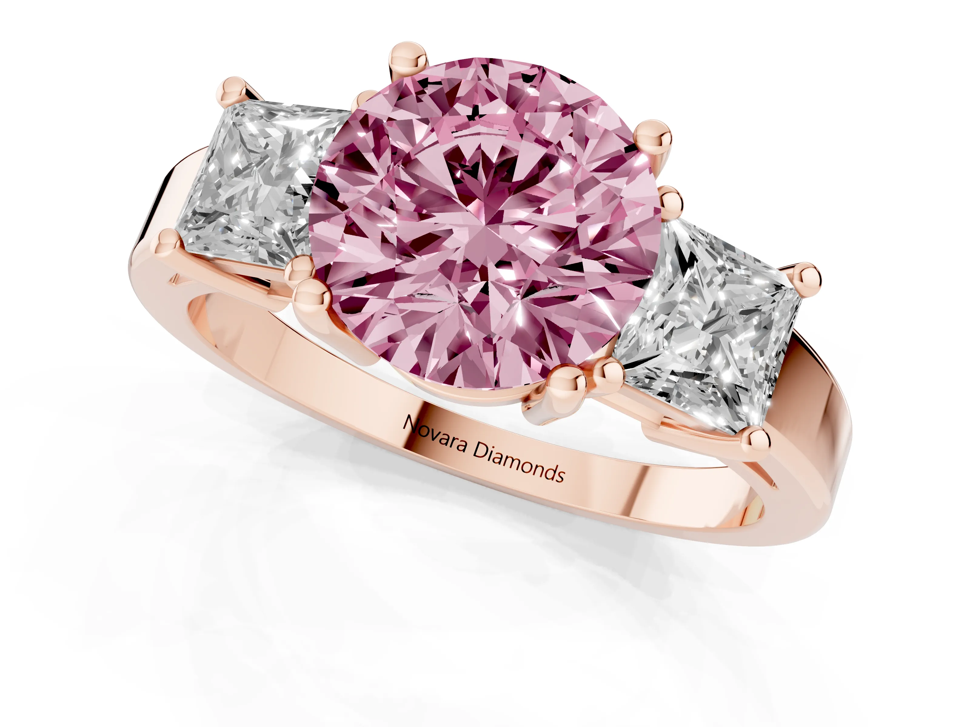 Fancy Pink Three-Stone Round Cut Diamond Solitaire Ring Set in Rose gold with Prong Setting