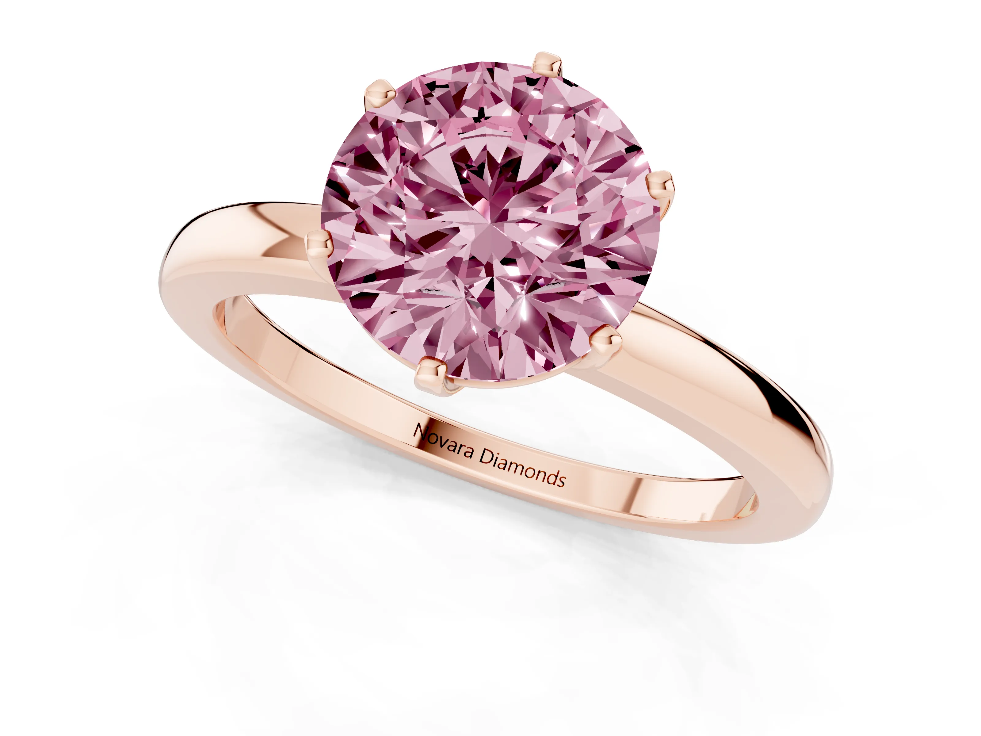 Fancy Pink Round Cut Diamond Solitaire Ring Set in Rose gold with Raised Prong Setting on a Classic Band