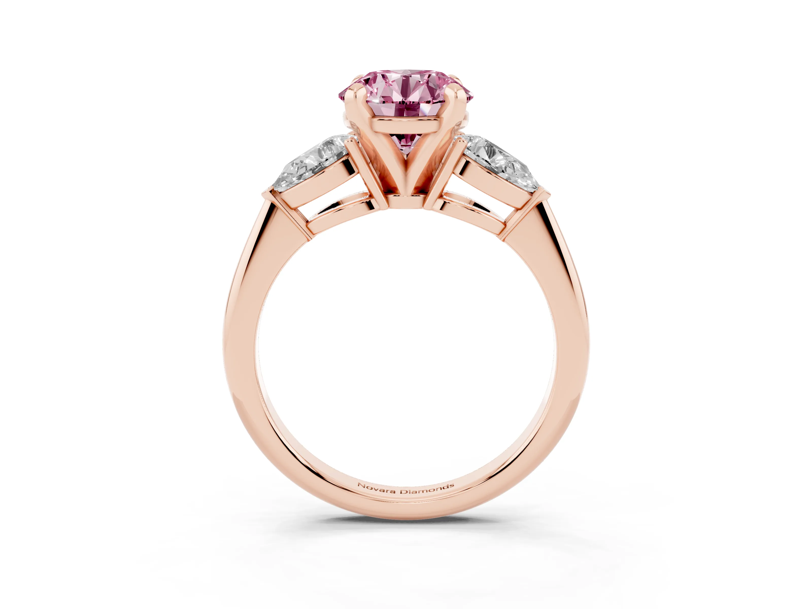 Fancy Pink Three-Stone Round Cut Diamond Ring Set in Rose gold with Pear Side Stones and Prong Setting