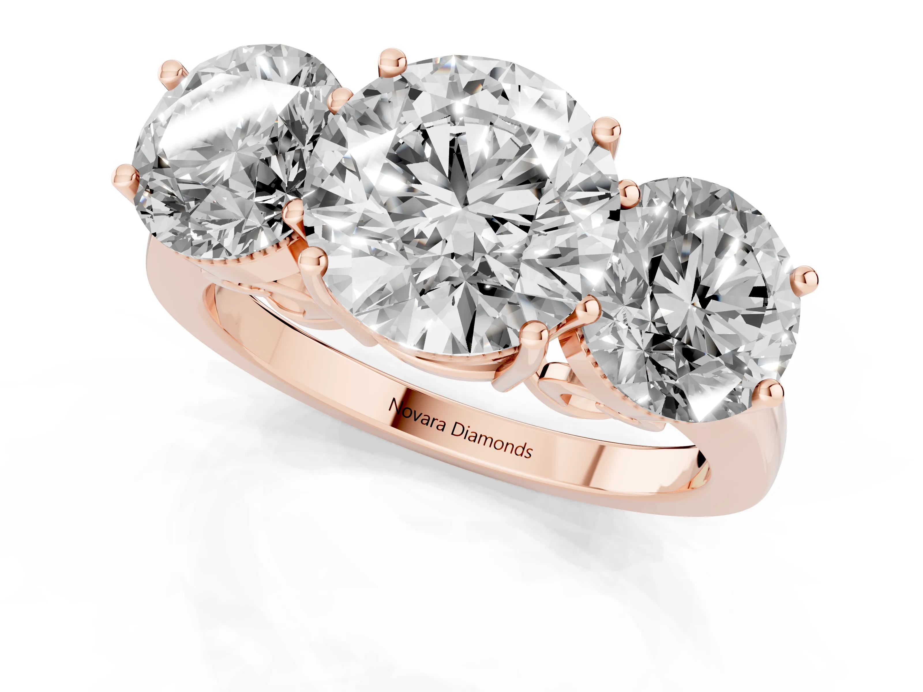 Round Cut Diamond Three-Stone Engagement Ring Set in Rose gold with Polished Band