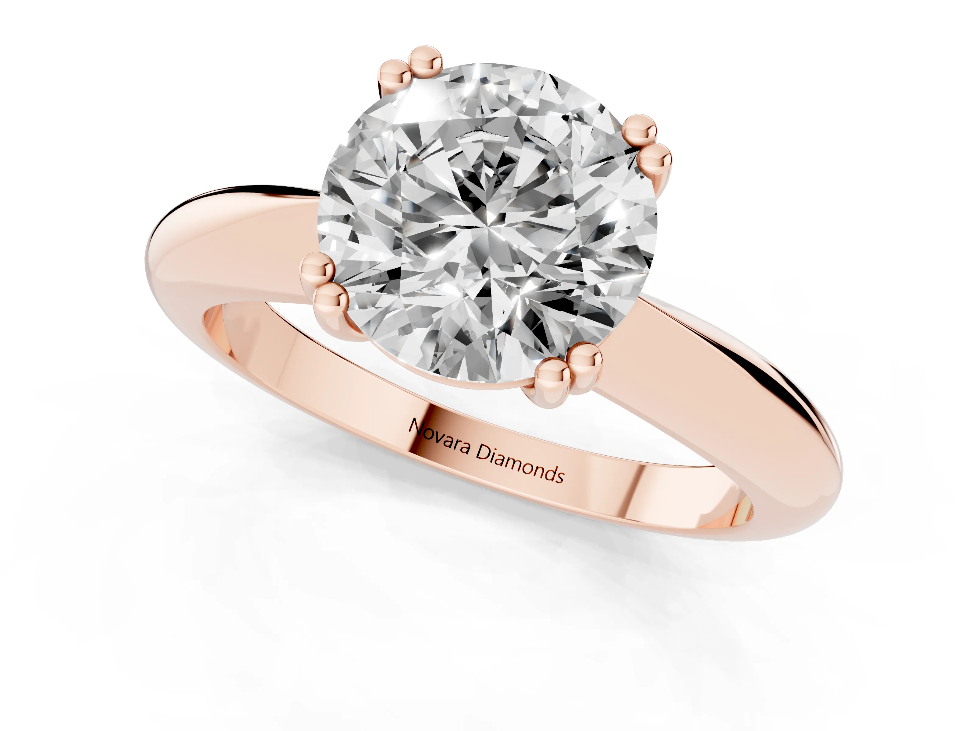 Round Cut Diamond Solitaire Engagement Ring Set in Rose gold with Tapered Band and Prong Setting