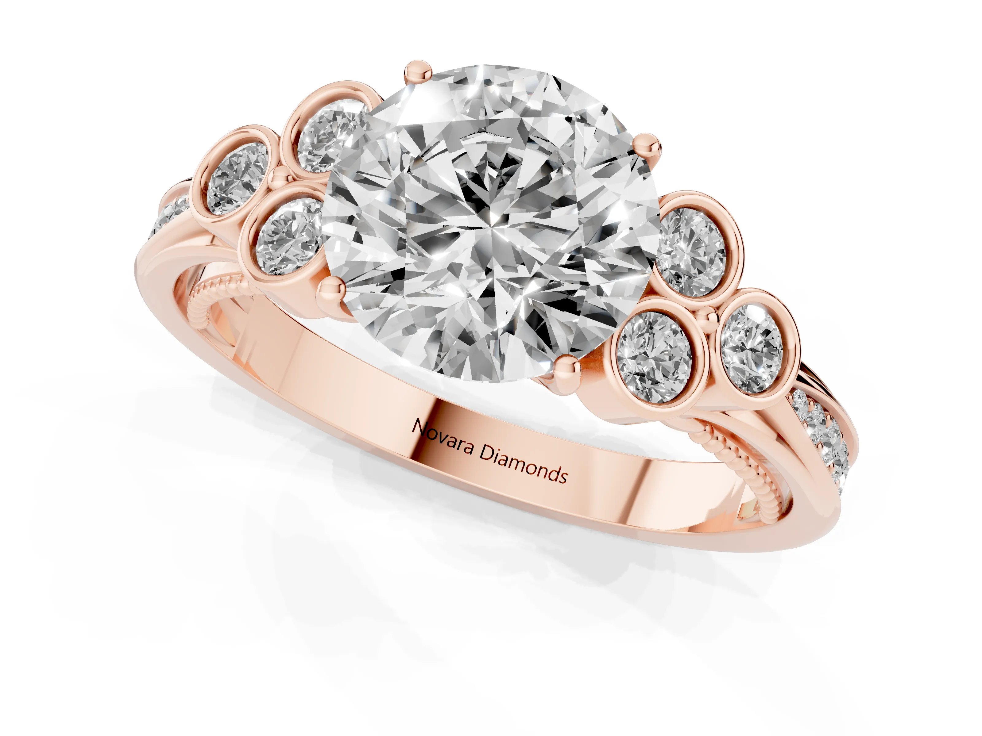 Round Cut Diamond Engagement Ring Set in Rose gold with Bezel Set Round Side Stones and Prong Setting