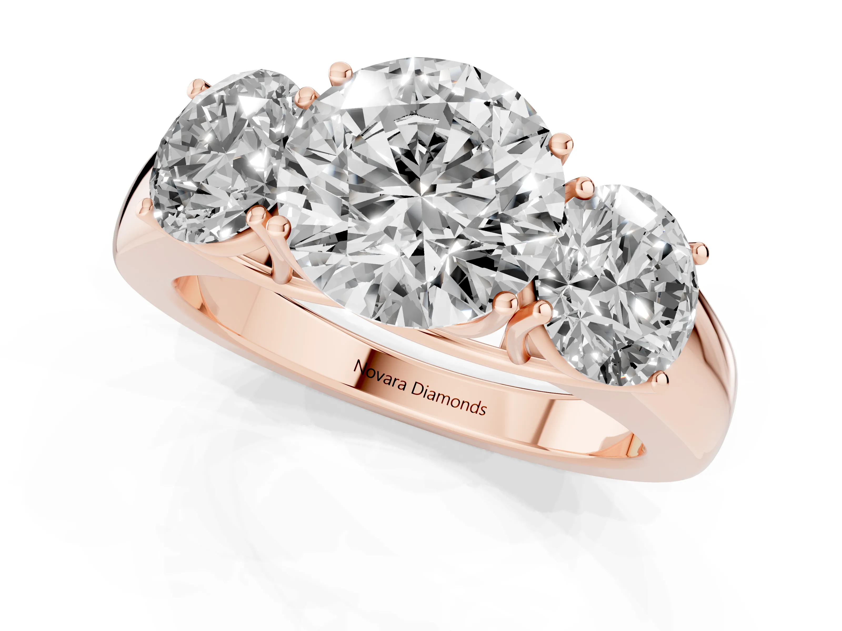 Three-Stone Round Cut Diamond Ring Set in Rose gold with Matching Prong Settings and Plain Band