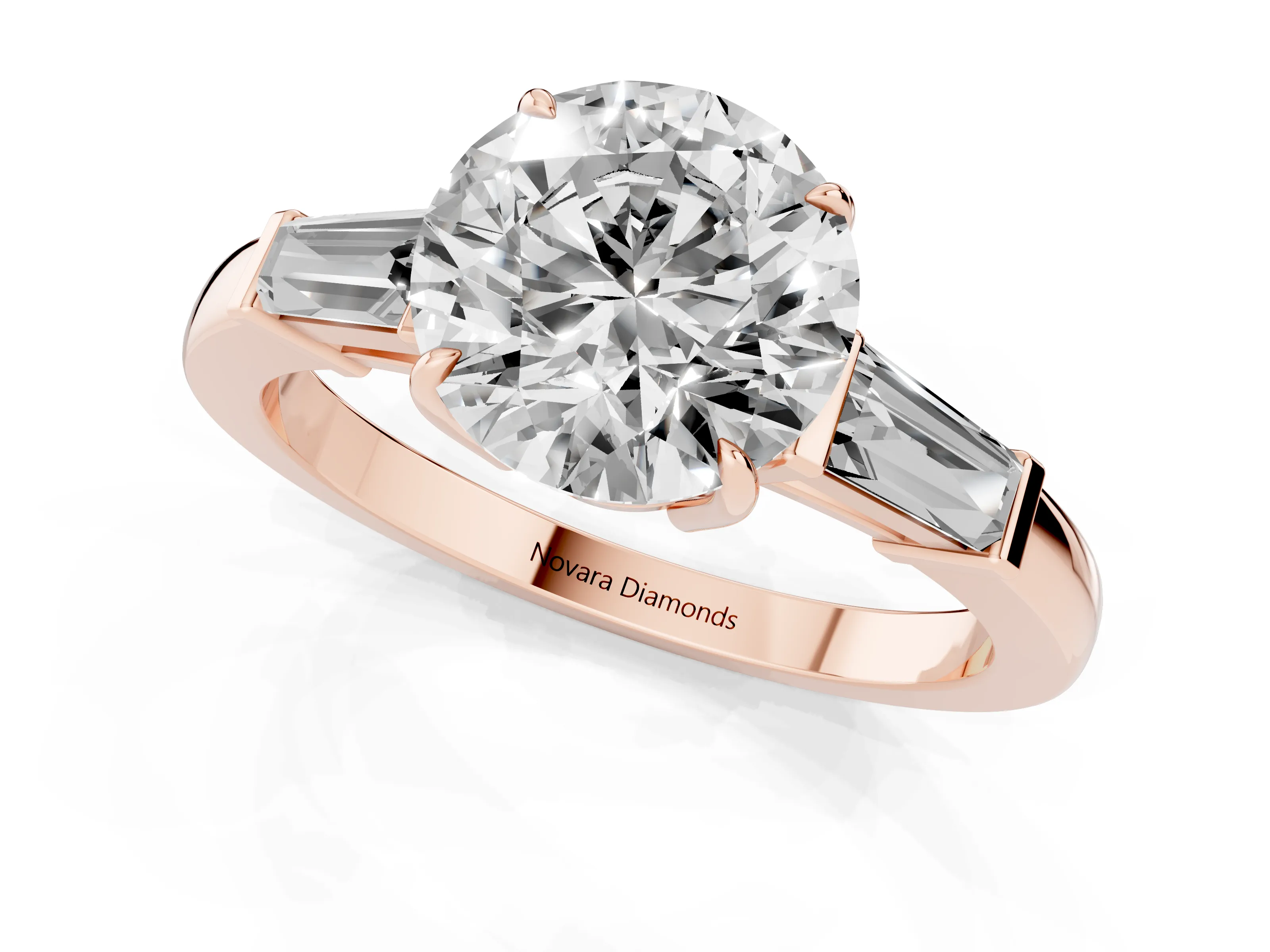 Round Cut Diamond Three-Stone Ring Set in Rose gold with Tapered Baguette Side Stones and Prong Setting