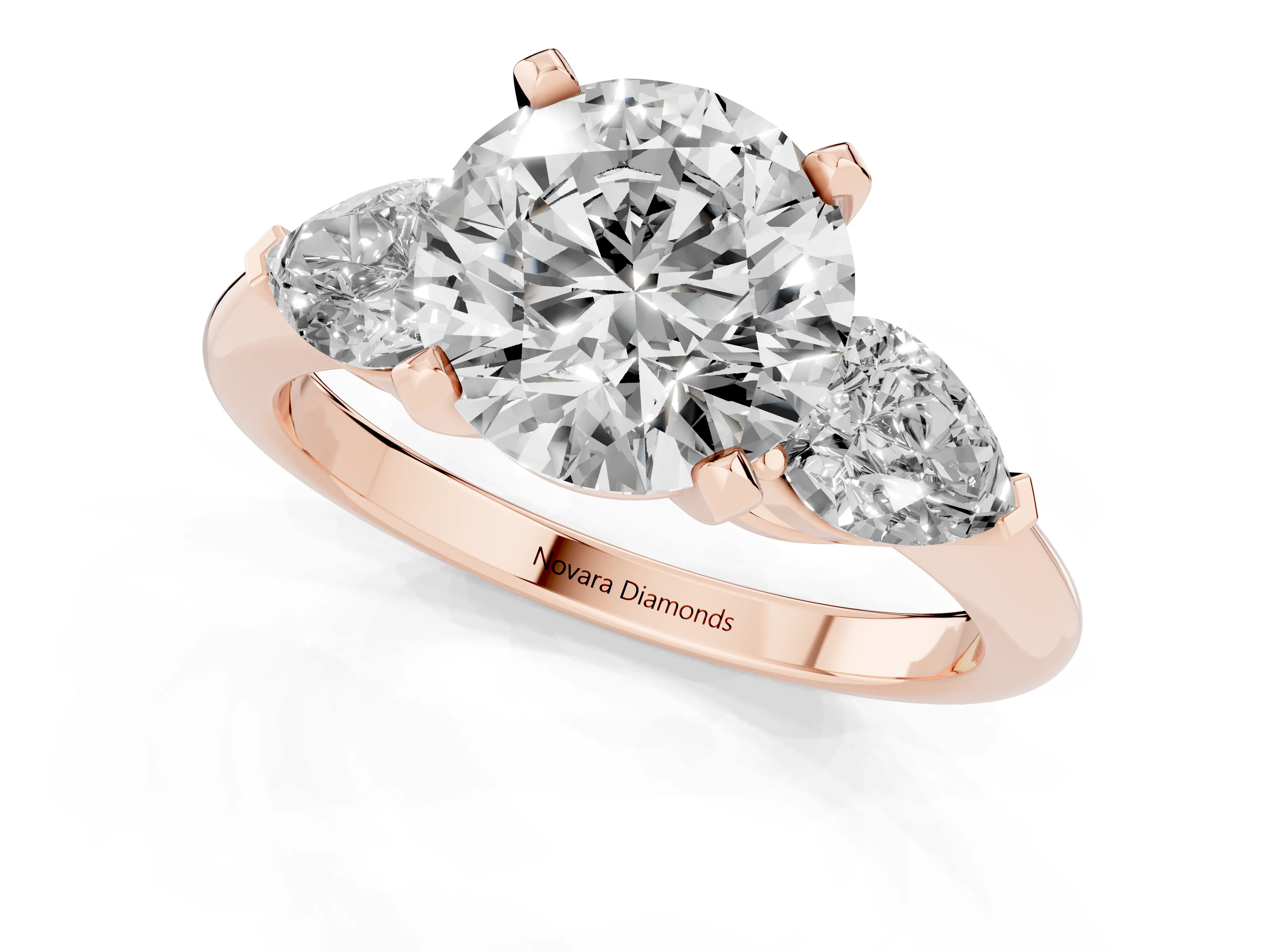 Three-Stone Round Cut Diamond Ring Set in Rose gold with Pear Side Stones and Prong Setting