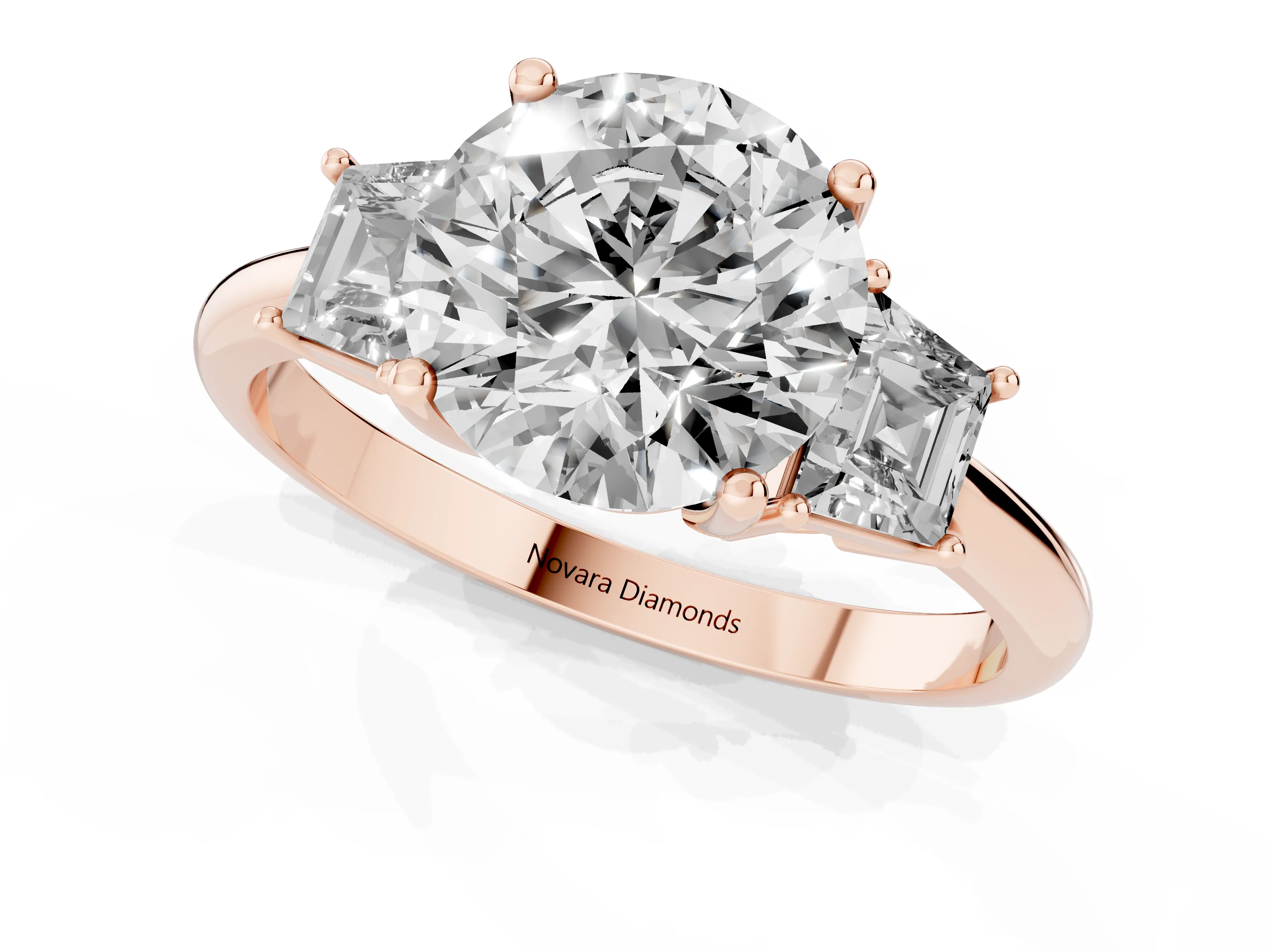 Round Cut Diamond Three-Stone Ring Set in Rose gold with Trapezoid Side Stones and Prong Setting