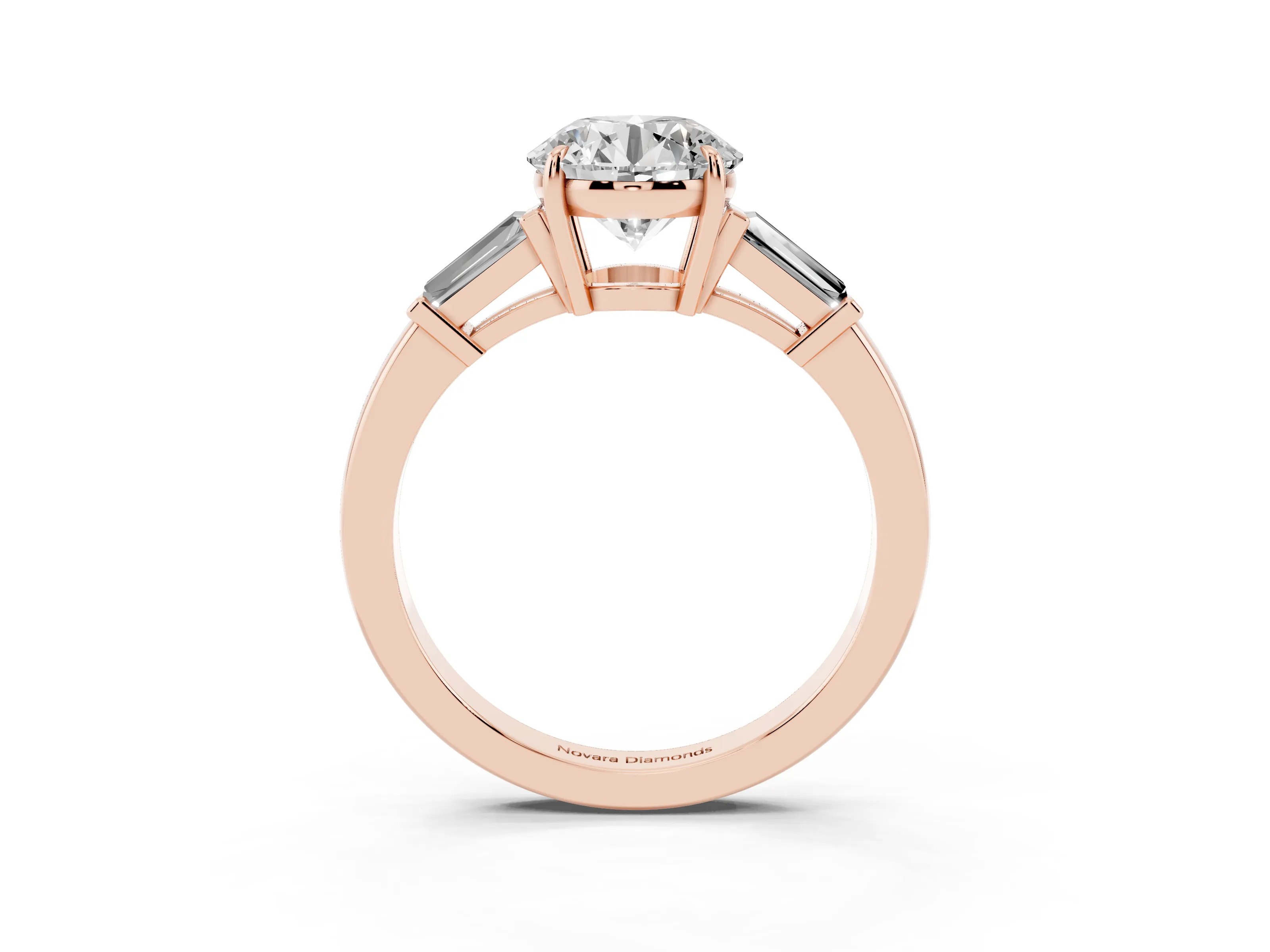 Round Cut Diamond Three-Stone Ring Set in Rose gold with Tapered Baguette Side Stones and Prong Setting