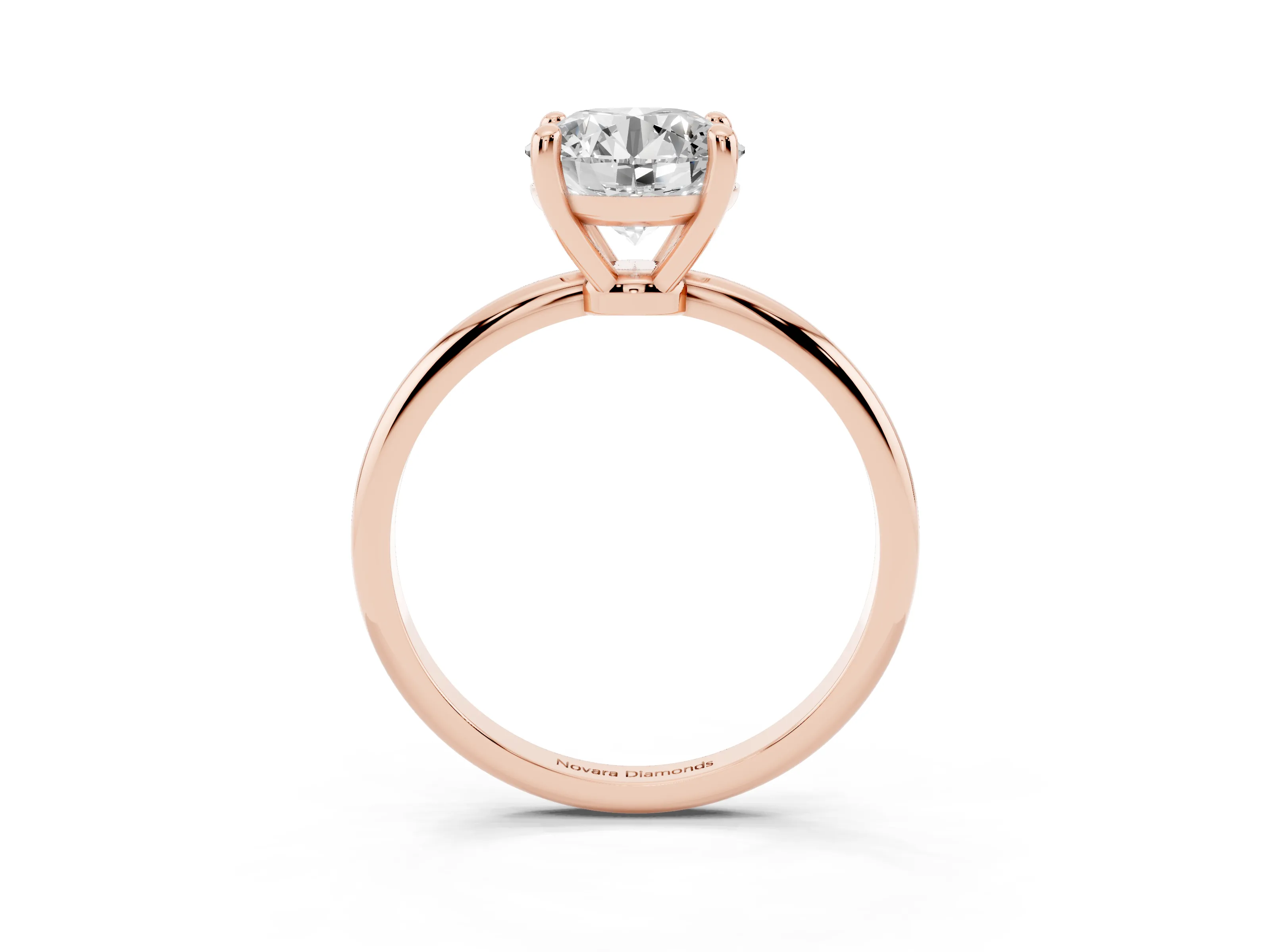Round Cut Diamond Solitaire Ring Set in Rose gold with Secure Prong Setting on a Classic Band