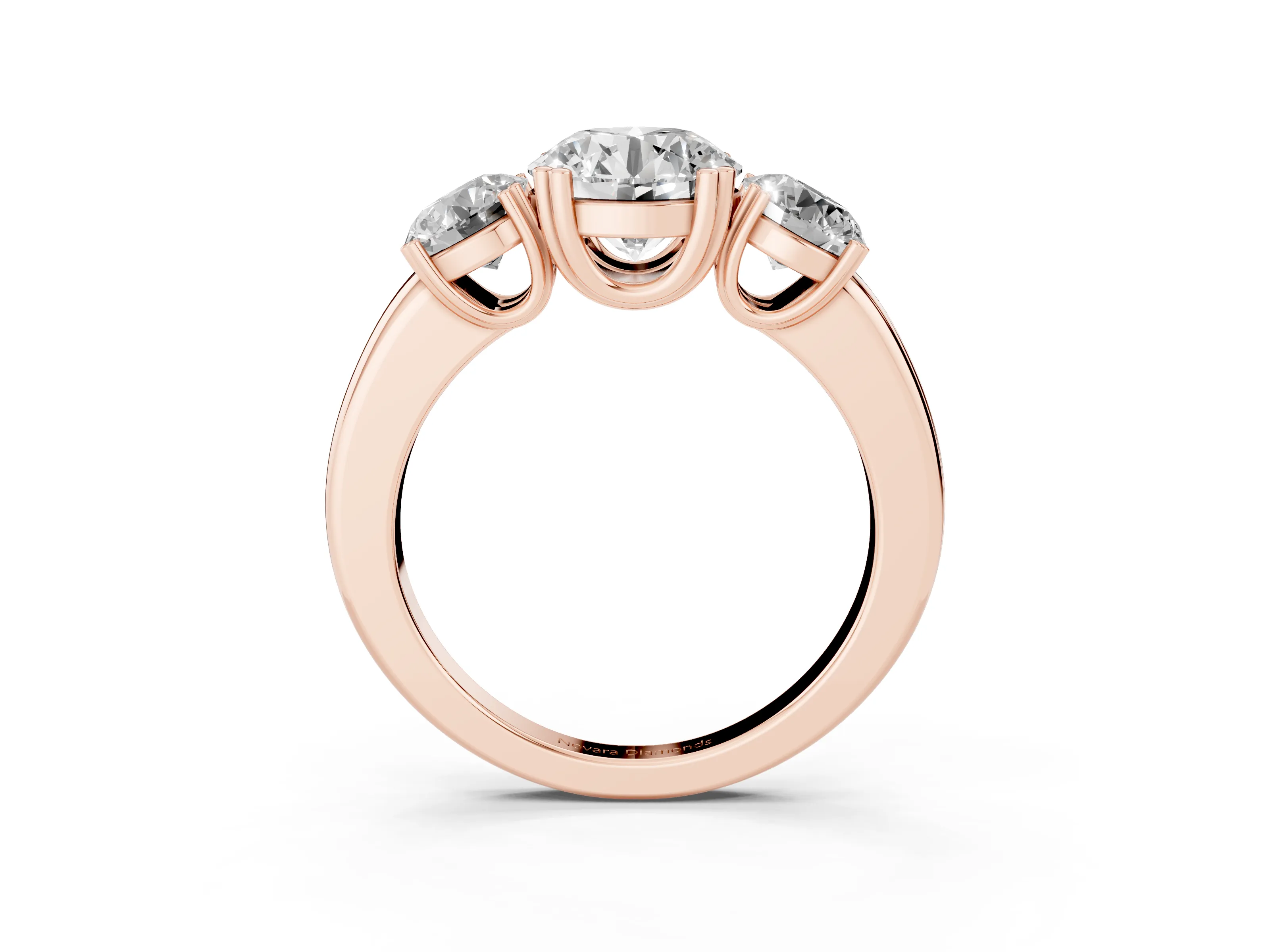 Round Cut Diamond Three-Stone Ring Set in Rose gold with Polished Channel-Set Band
