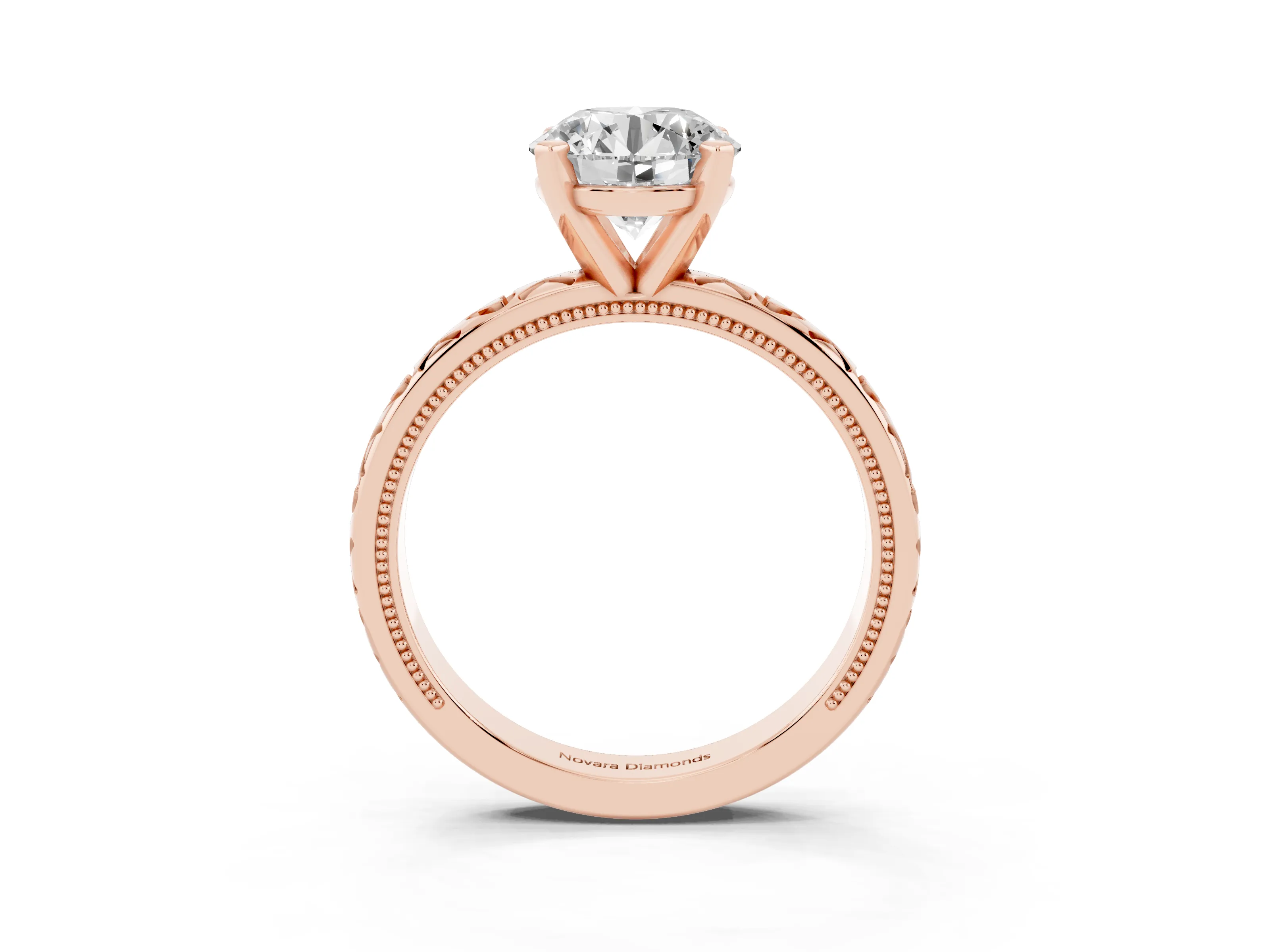 Round Cut Diamond Solitaire Engagement Ring Set in Rose gold with XO Engraved Band and Prong Setting
