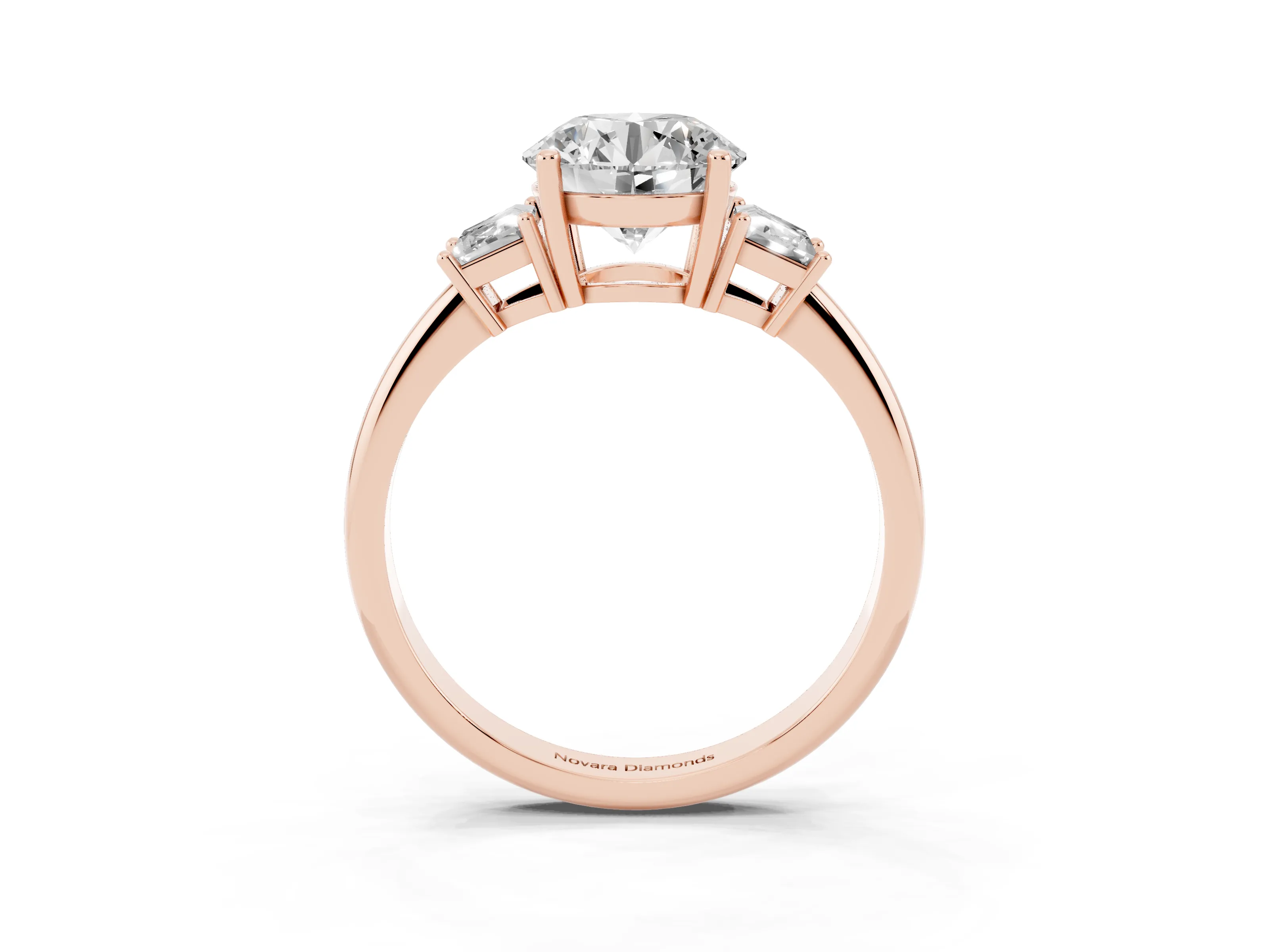 Round Cut Diamond Three-Stone Ring Set in Rose gold with Trapezoid Side Stones and Prong Setting