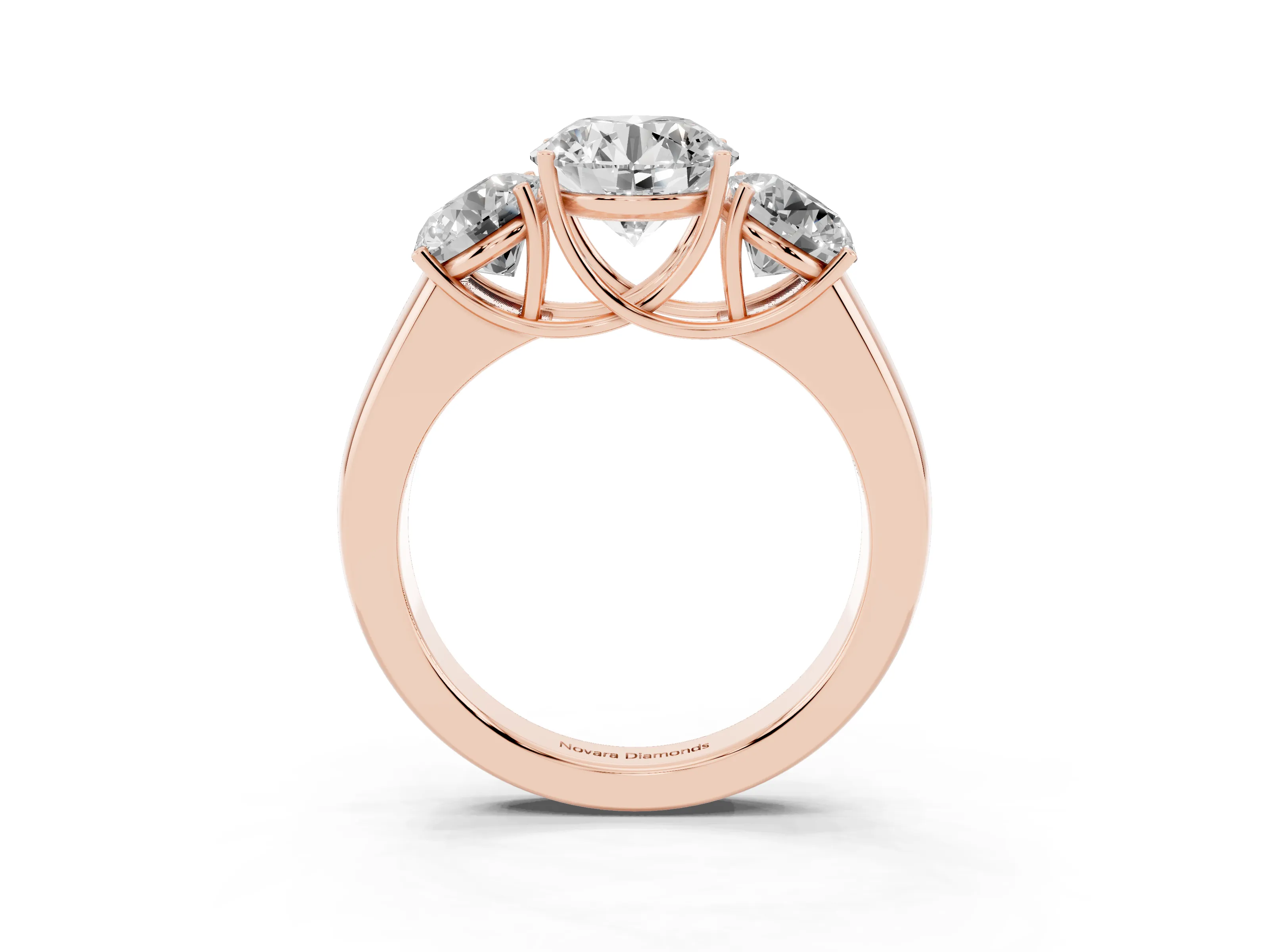 Three-Stone Round Cut Diamond Ring Set in Rose gold with Matching Prong Settings and Plain Band
