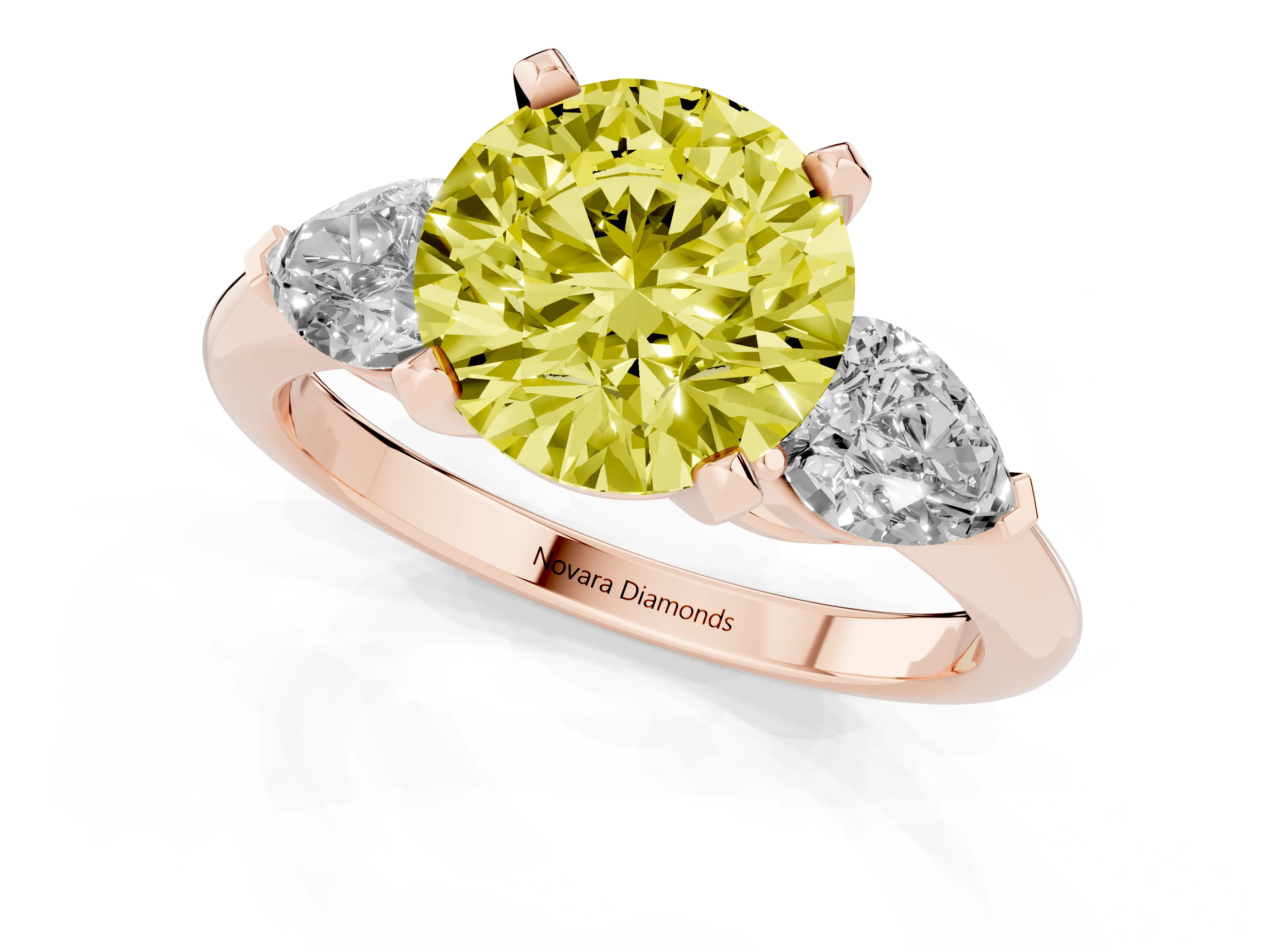 Fancy Yellow Three-Stone Round Cut Diamond Ring Set in Rose gold with Pear Side Stones and Prong Setting