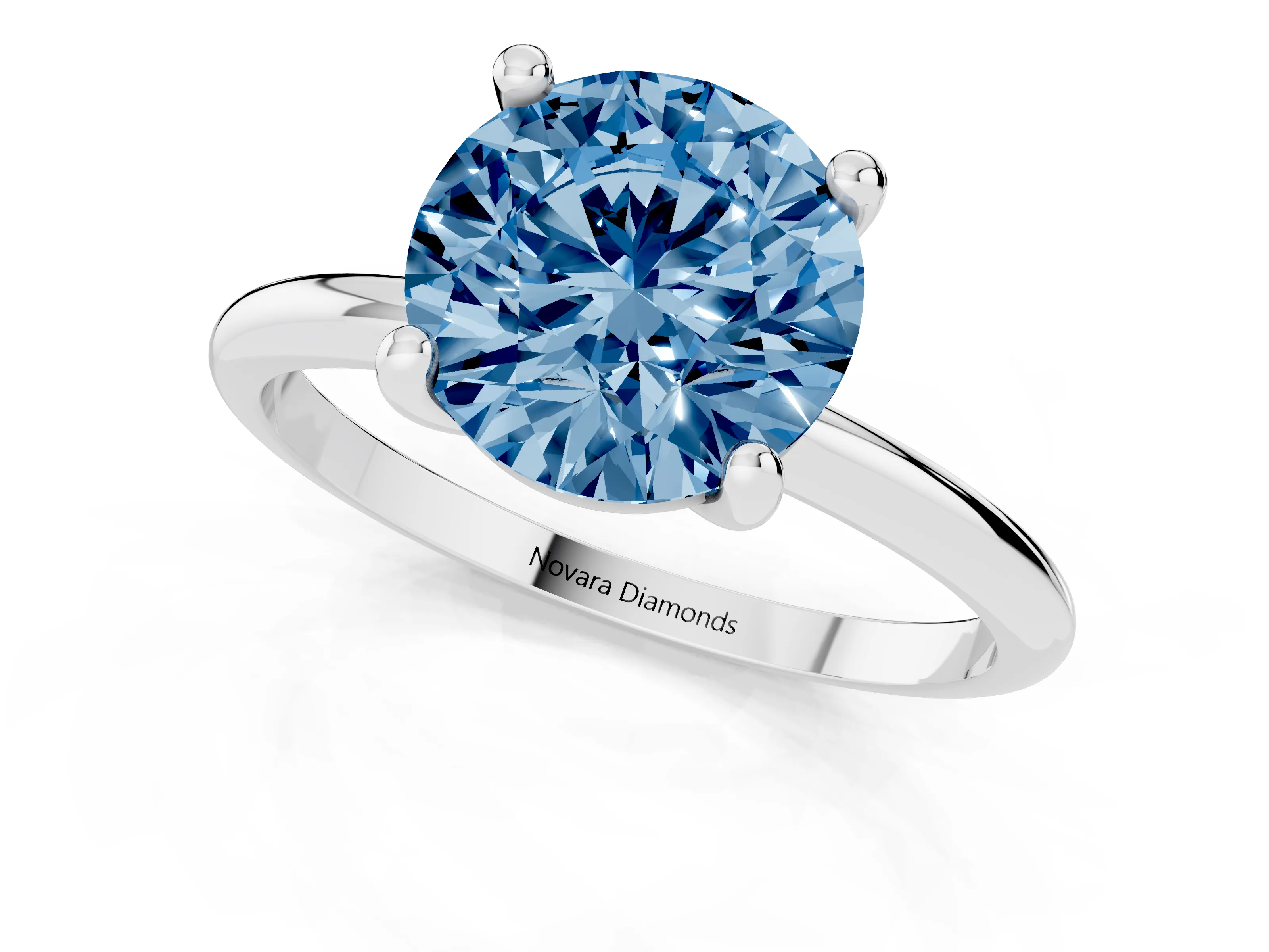 Fancy Blue Round Cut Diamond Solitaire Ring Set in White gold with Secure Prong Setting on a Classic Band