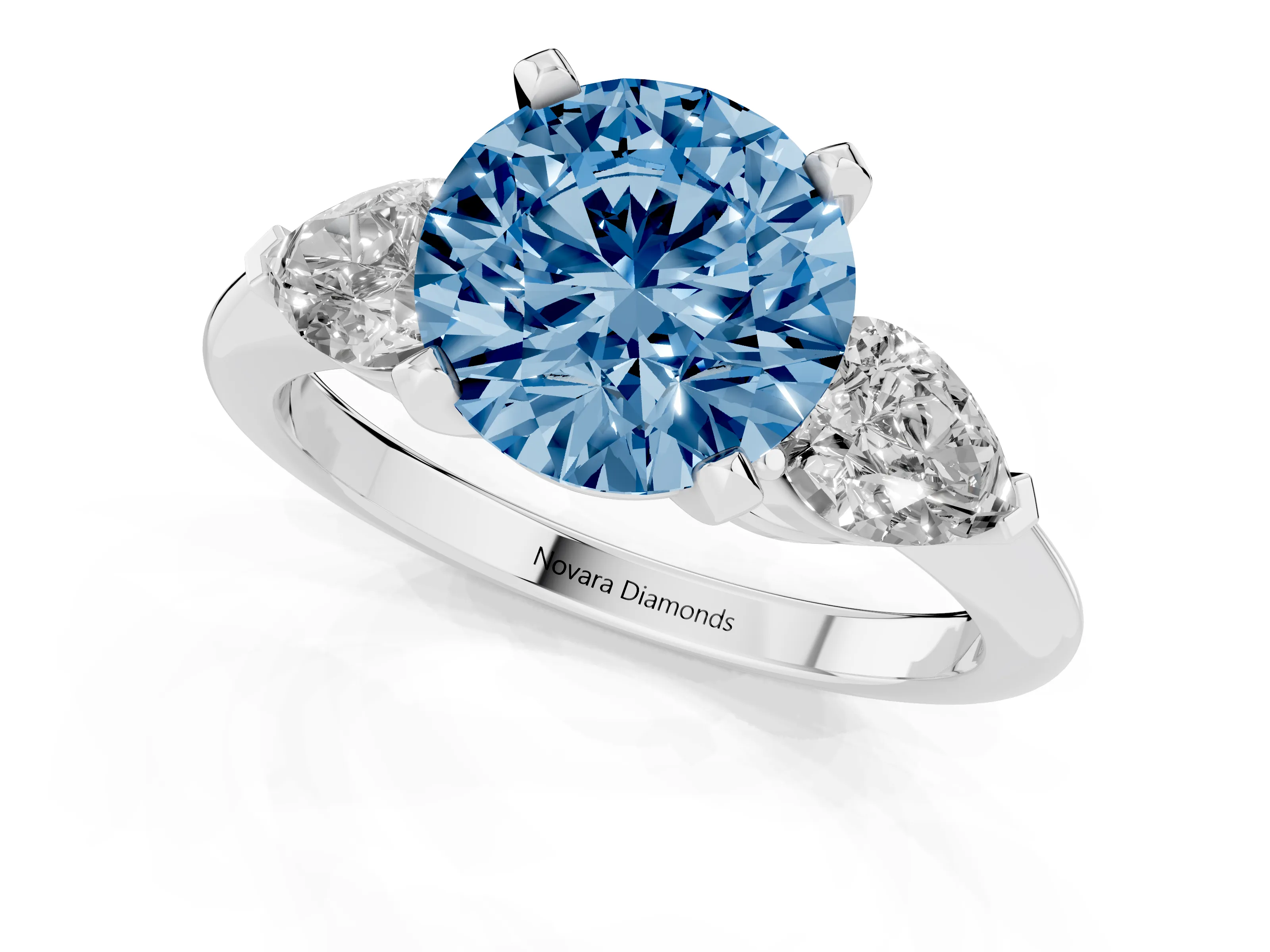 Fancy Blue Three-Stone Round Cut Diamond Ring Set in Silver with Pear Side Stones and Prong Setting