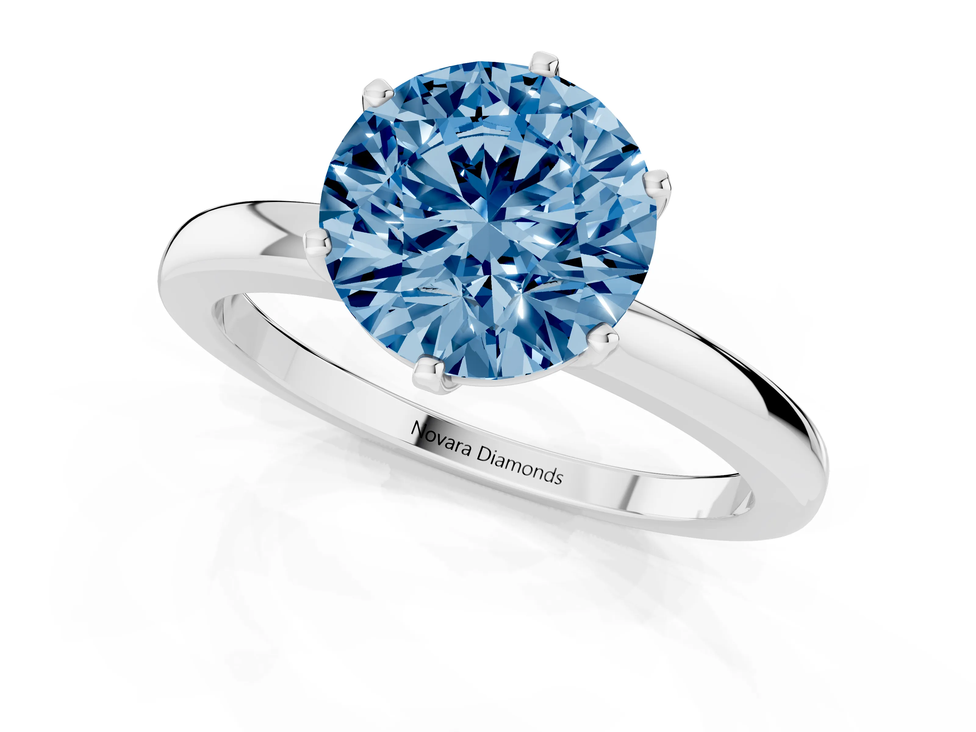 Fancy Blue Round Cut Diamond Solitaire Ring Set in White gold with Raised Prong Setting on a Classic Band
