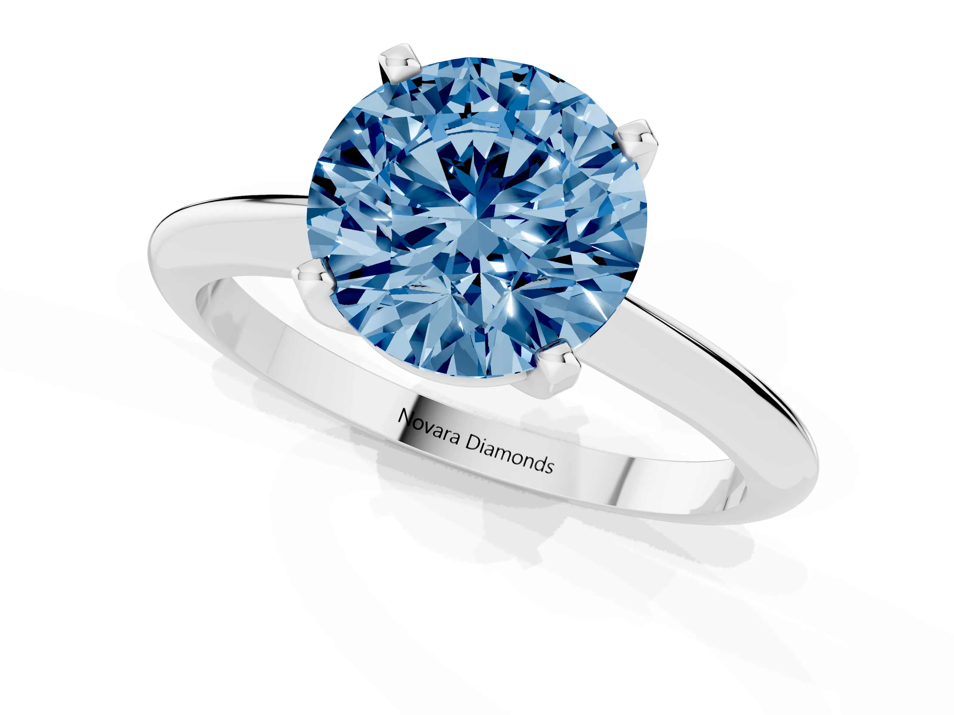 Fancy Blue Round Cut Diamond Solitaire Ring Set in Silver with Prong Setting on a Plain Round Band