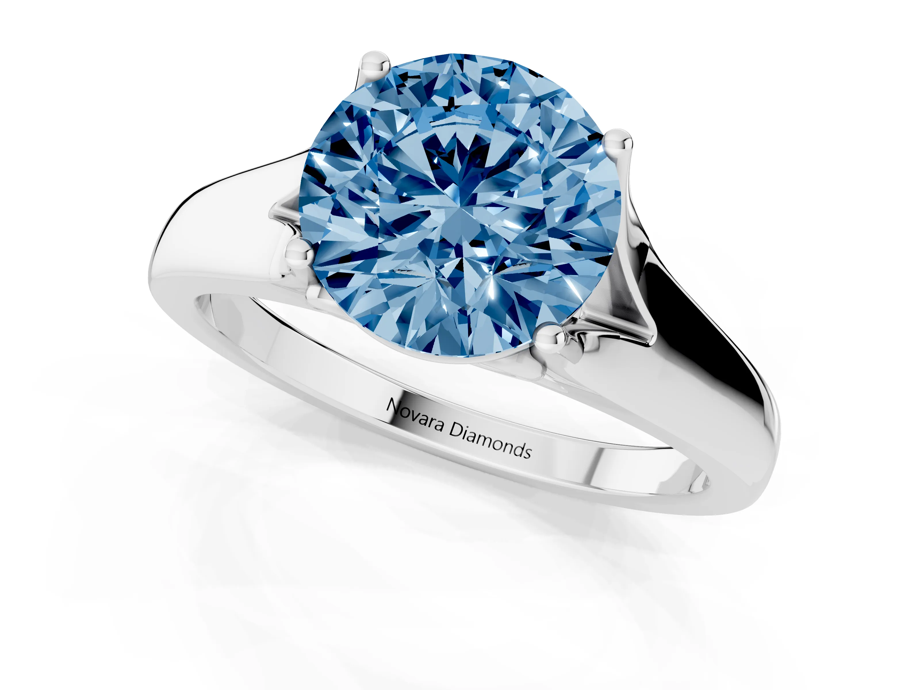 Fancy Blue Round Cut Diamond Solitaire Ring Set in White gold with Arched Cathedral Band and Prong Setting