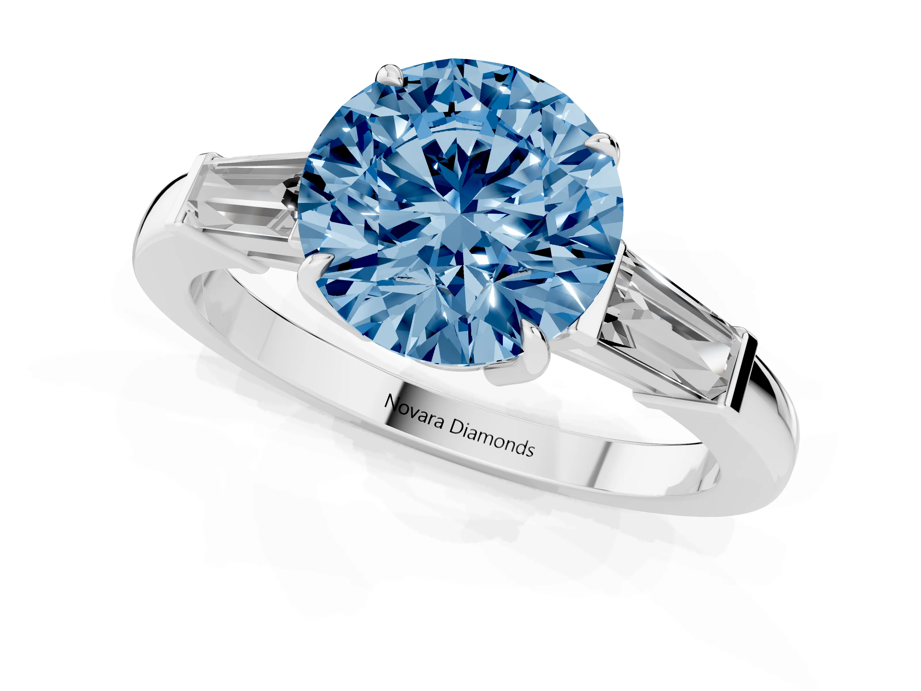 Fancy Blue Round Cut Diamond Three-Stone Ring Set in White gold with Tapered Baguette Side Stones and Prong Setting