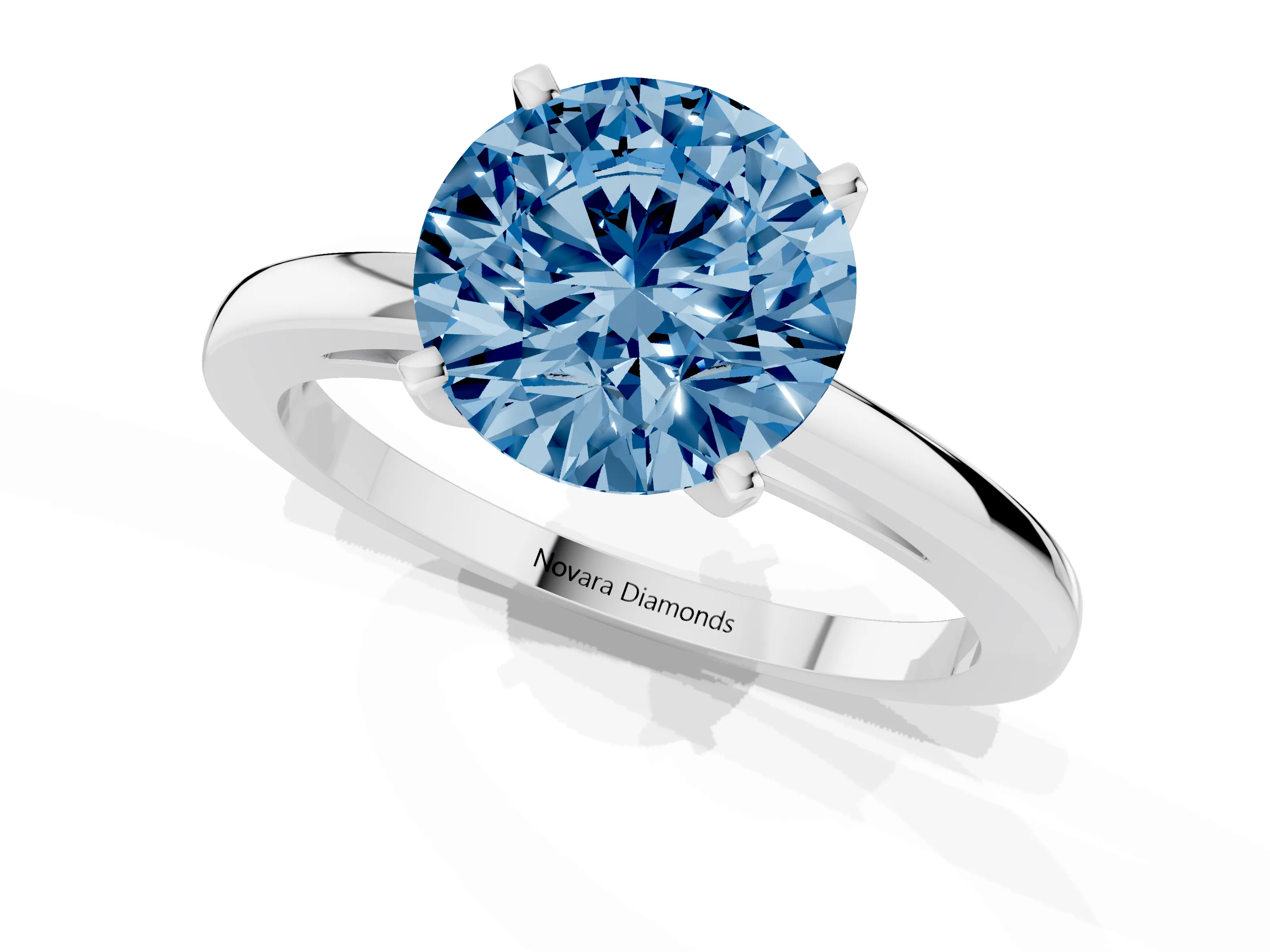 Fancy Blue Round Cut Diamond Solitaire Engagement Ring Set in White gold with Prong Setting on a Classic Band