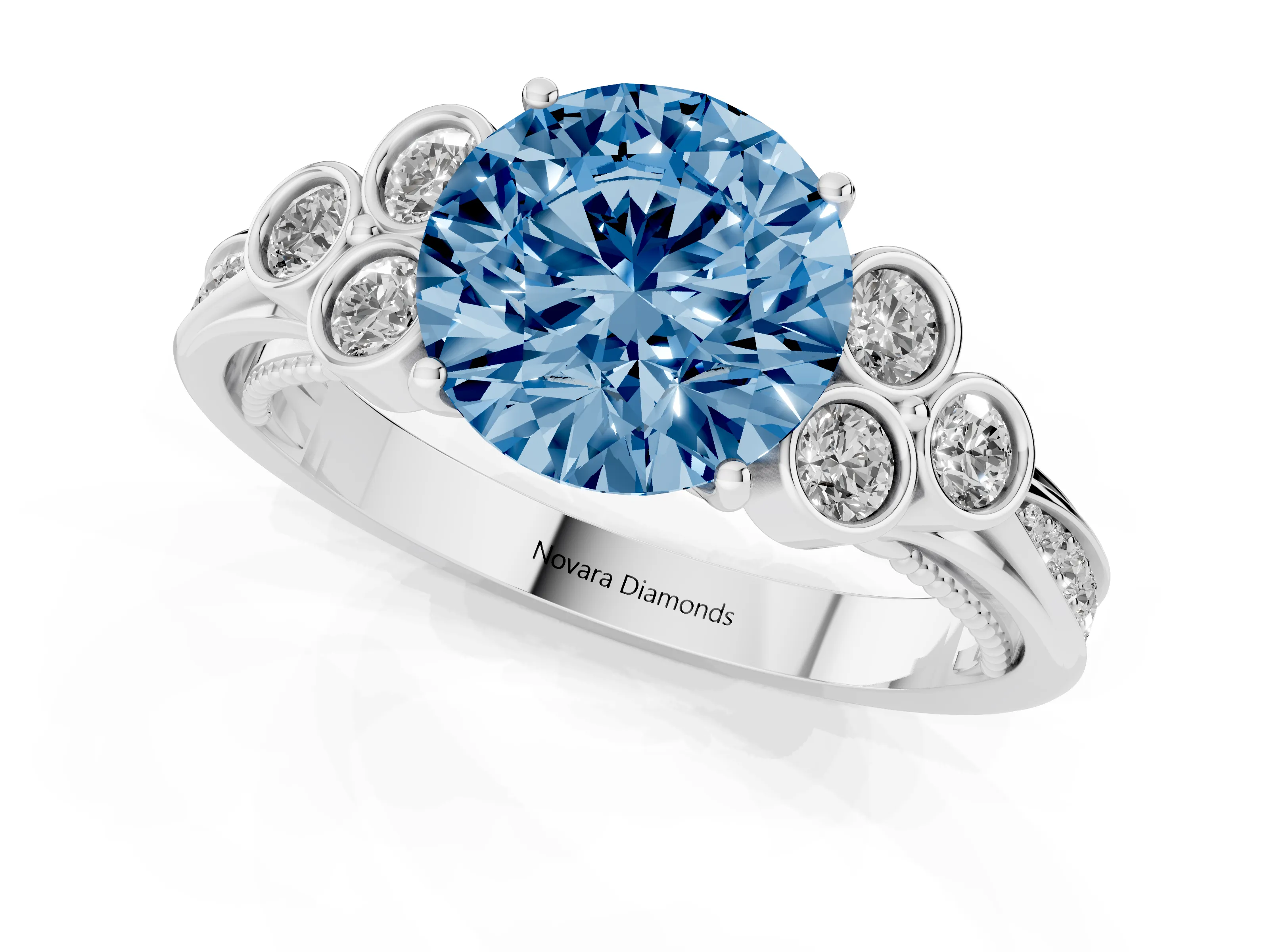 Fancy Blue Round Cut Diamond Engagement Ring Set in Platinum with Bezel Set Round Side Stones and Prong Setting