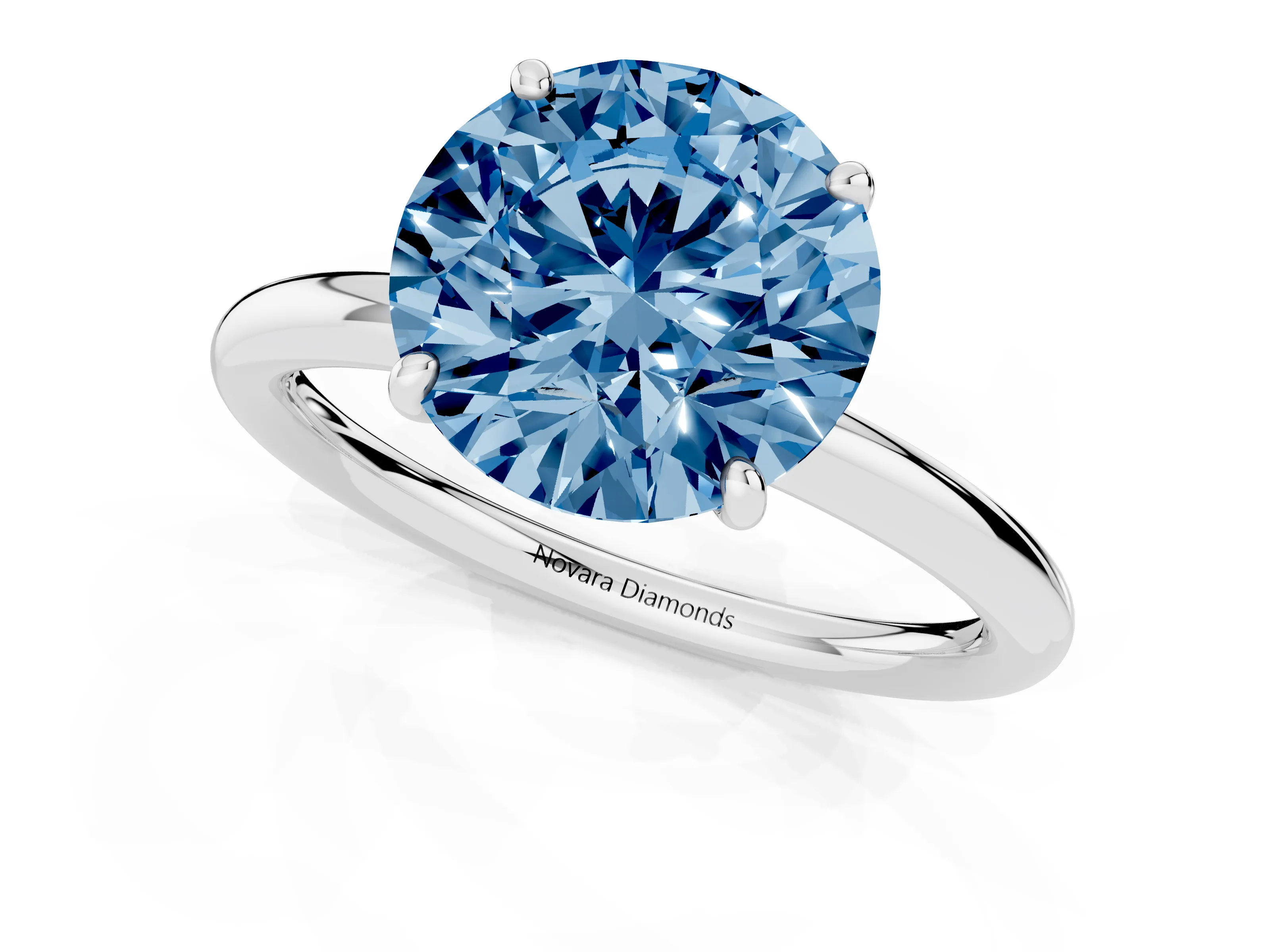 Fancy Blue Round Cut Diamond Solitaire Ring Set in Silver with Prong Setting on a Polished Plain Band