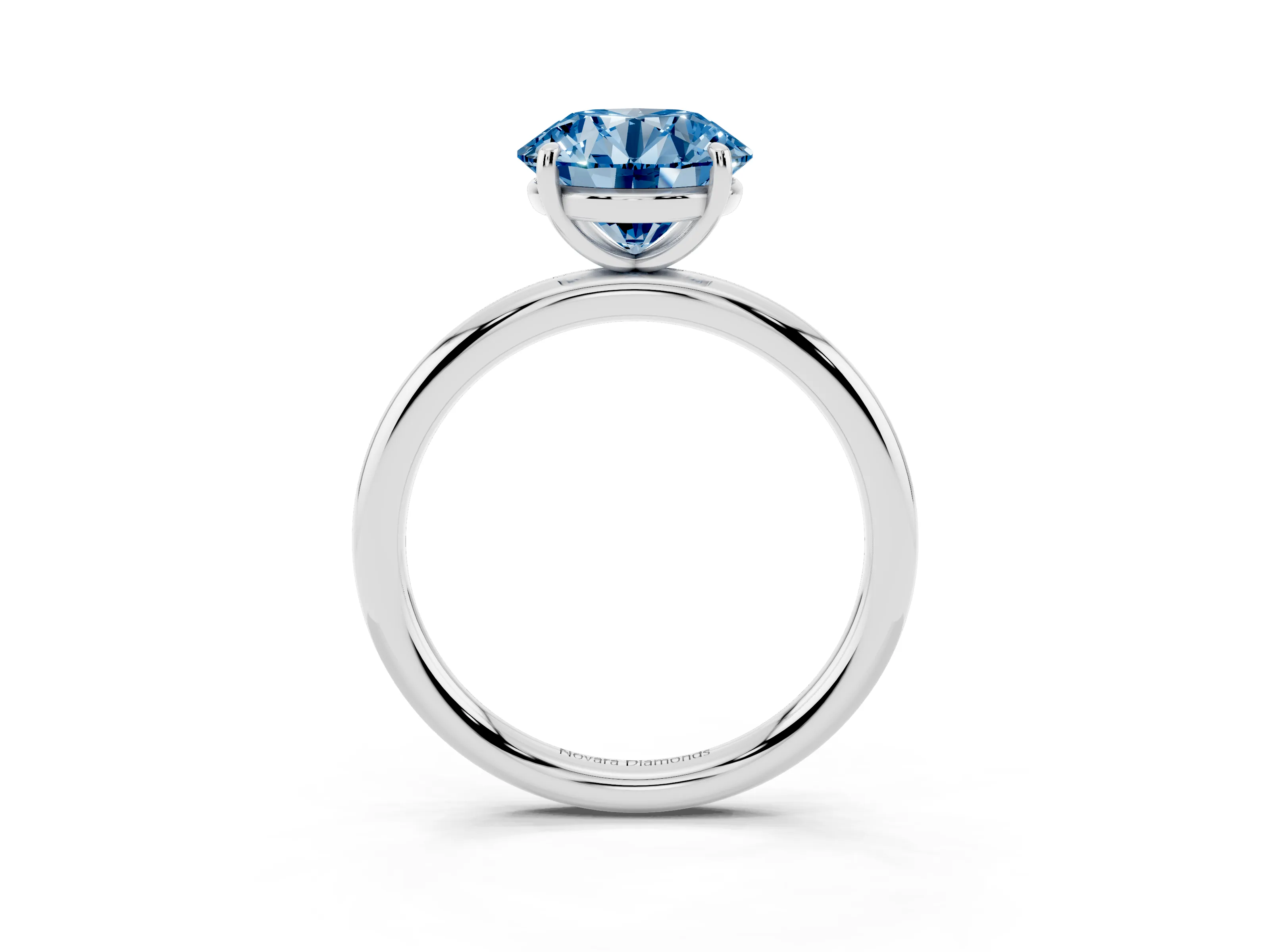 Fancy Blue Round Cut Diamond Solitaire Ring Set in Silver with Prong Setting on a Polished Plain Band