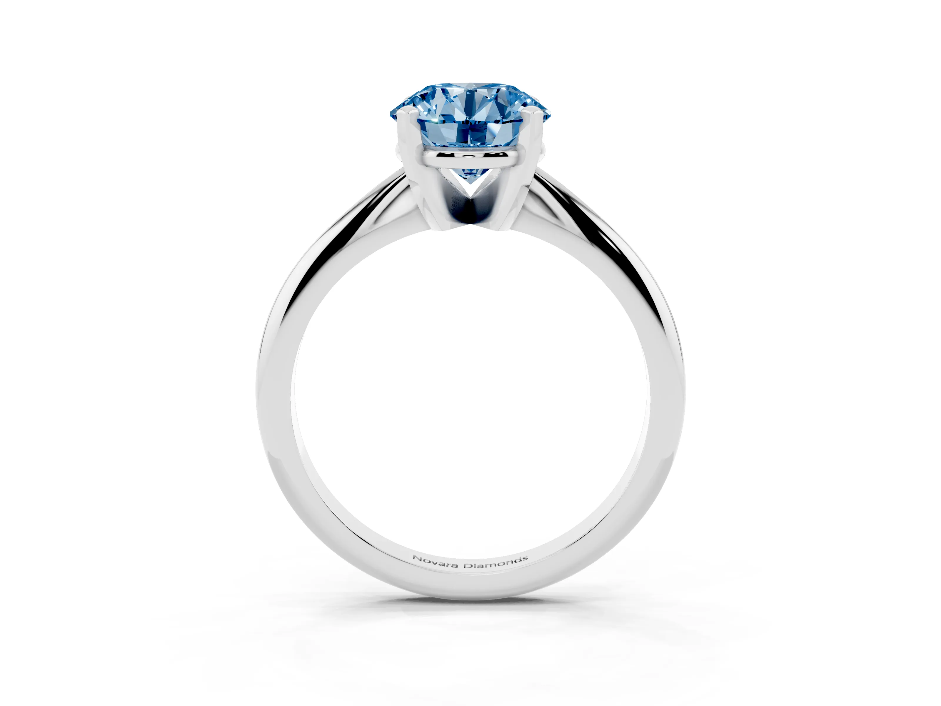 Fancy Blue Round Cut Diamond Solitaire Ring Set in Silver with Prong Setting on a Plain Round Band