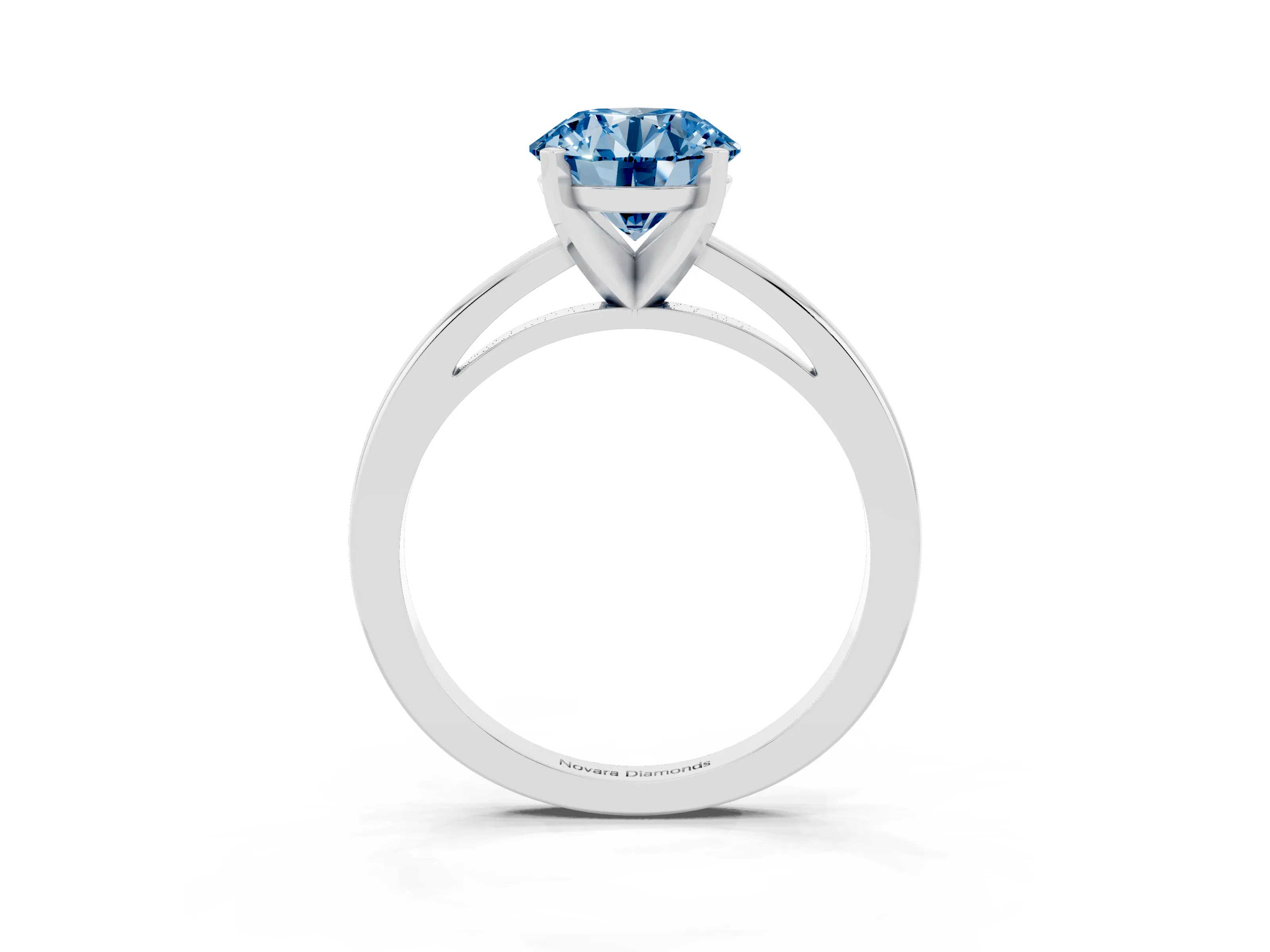 Fancy Blue Round Cut Diamond Solitaire Engagement Ring Set in White gold with Prong Setting on a Classic Band