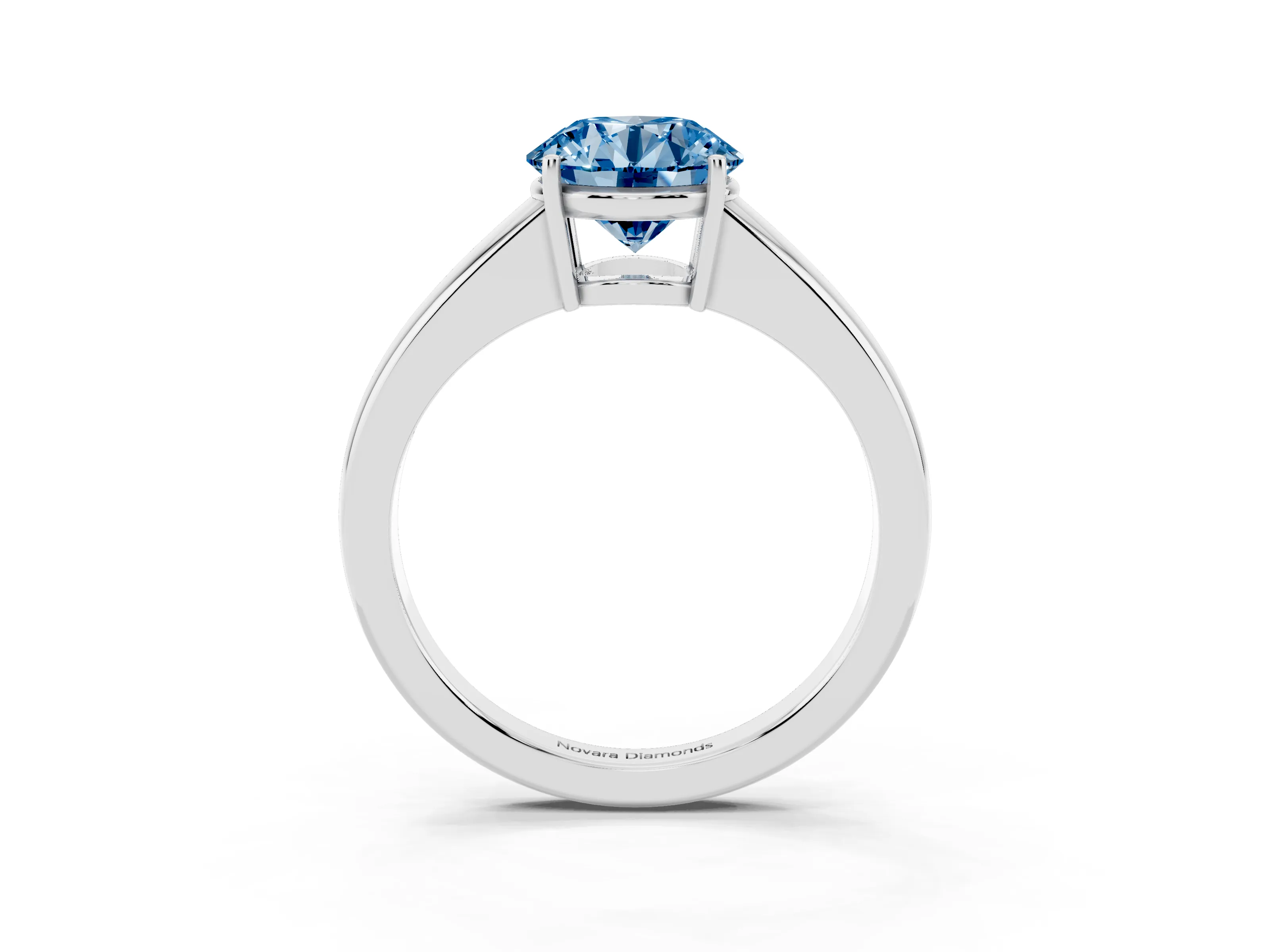 Fancy Blue Round Cut Diamond Solitaire Ring Set in Silver with Tapered Band and Prong Setting