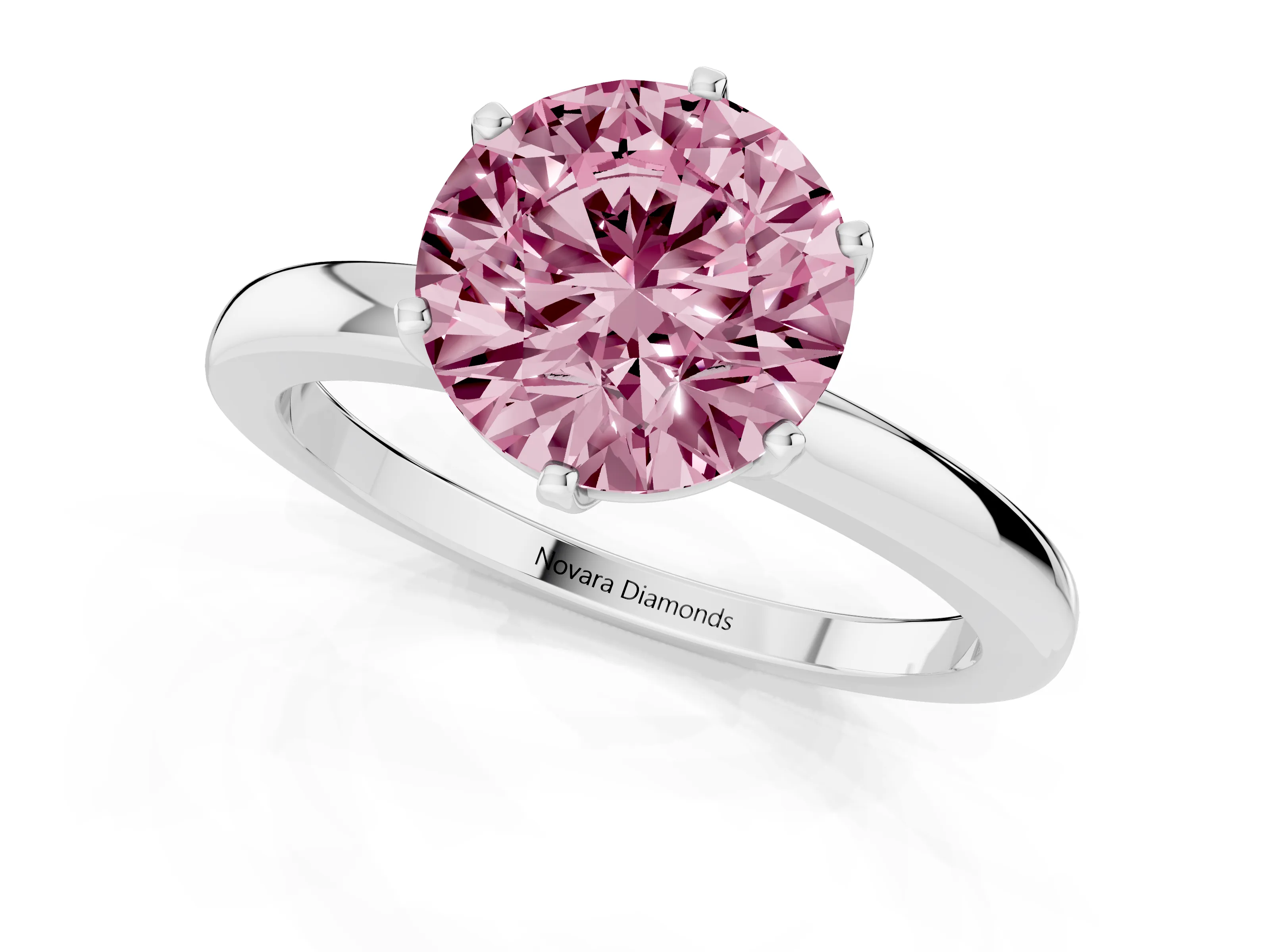 Fancy Pink Round Cut Diamond Solitaire Ring Set in Silver with Raised Prong Setting on a Classic Band