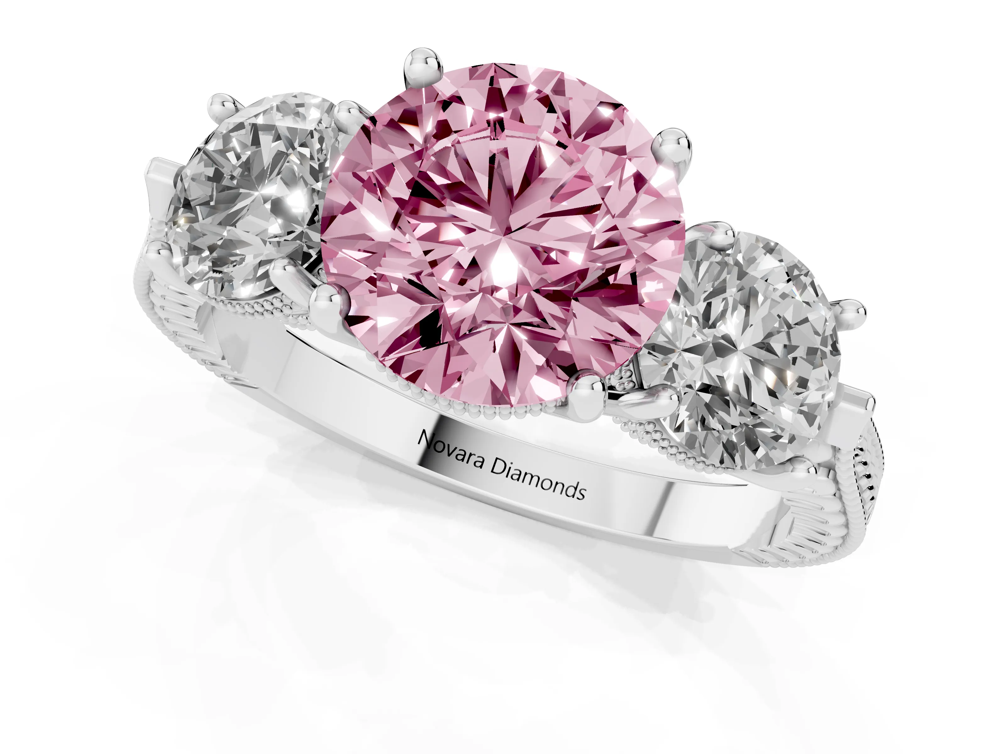 Fancy Pink Round Cut Diamond Three-Stone Ring Set in Platinum with Milgrain Band