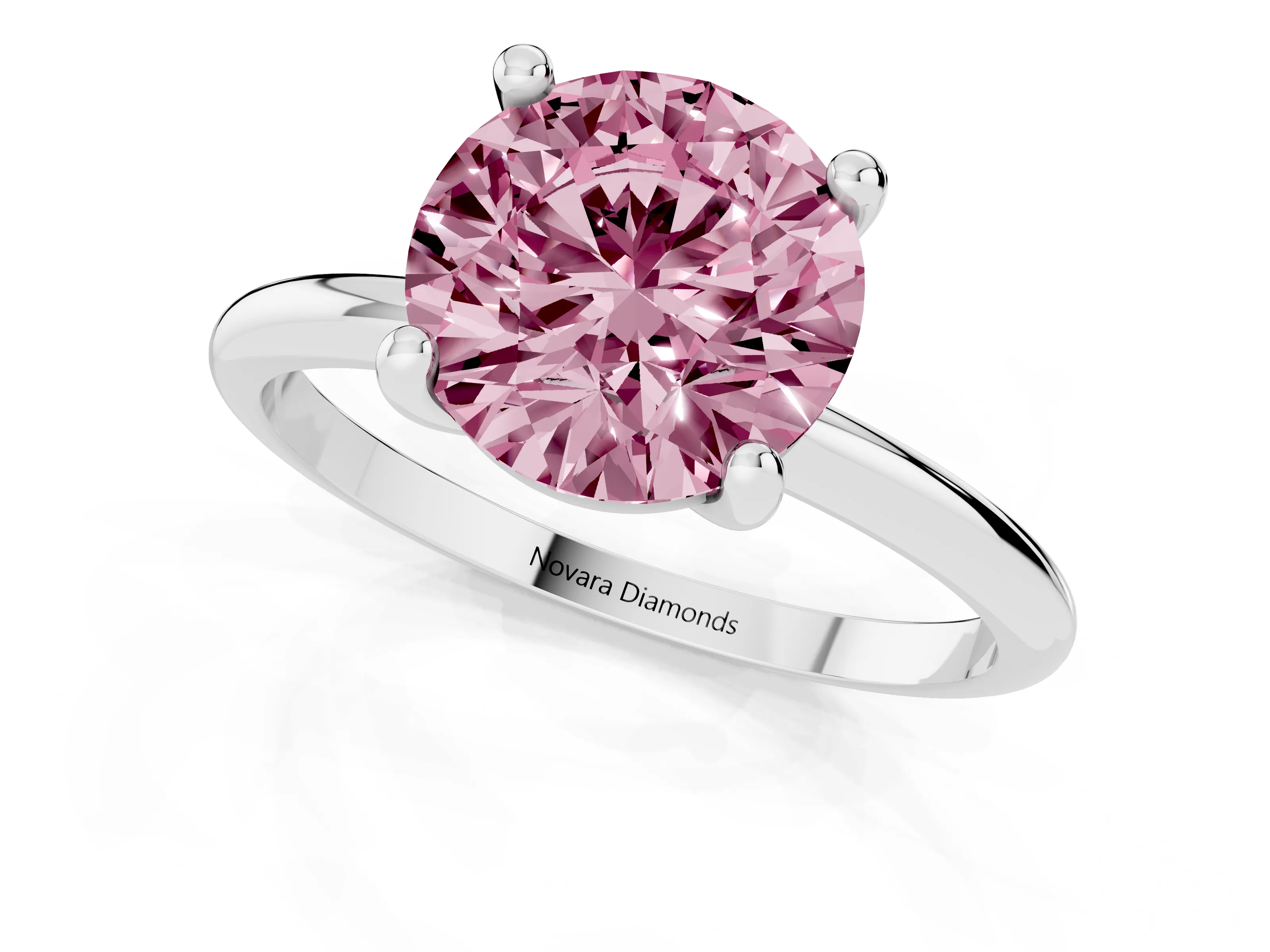 Fancy Pink Round Cut Diamond Solitaire Ring Set in Silver with Secure Prong Setting on a Classic Band